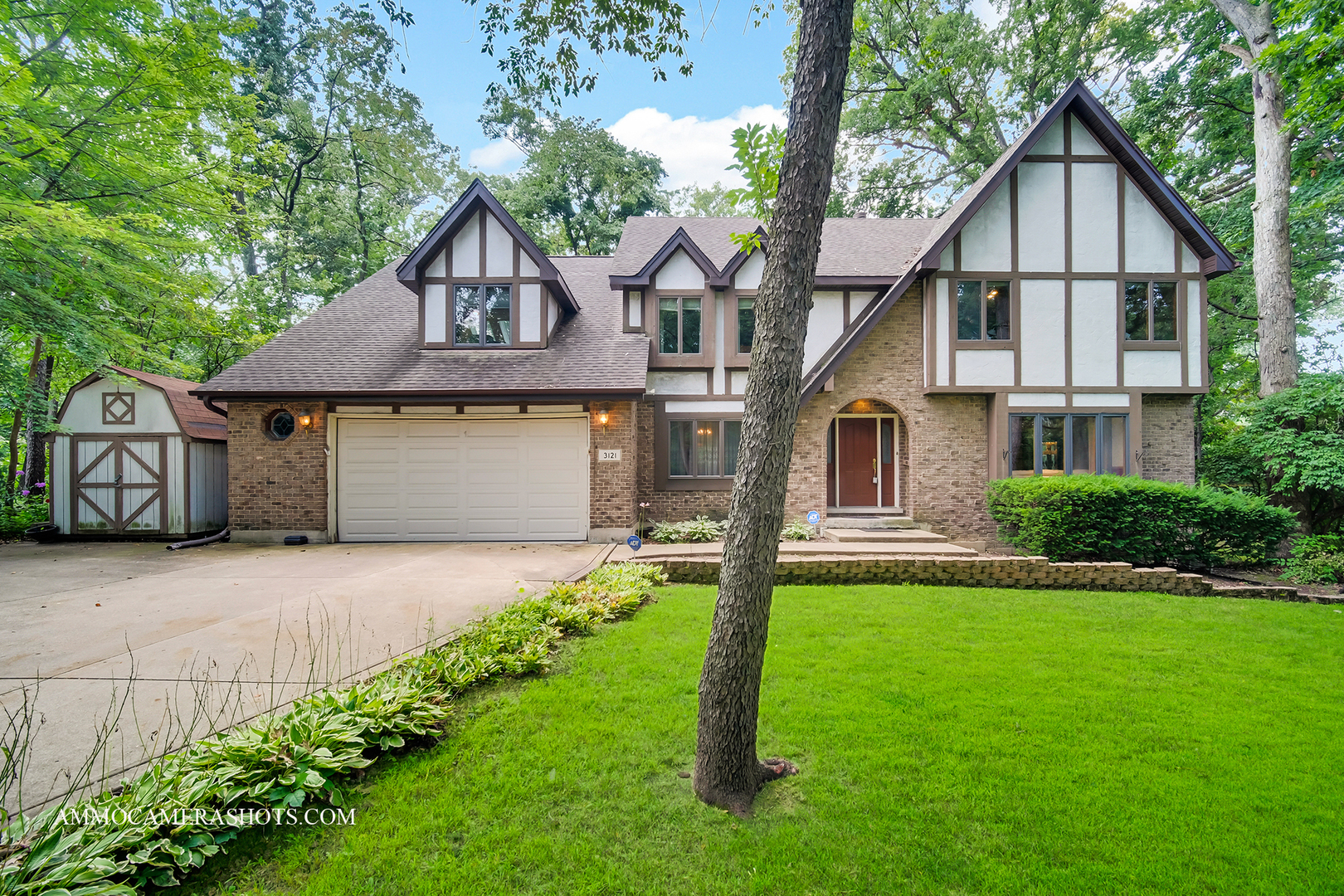 A Private Retreat Like No Other!  Welcome to this stunning 3,500 sq. ft. home, with 4 Bedrooms, a Loft and a Sunroom and a Finished Basement! This home is nestled on a quiet wooded cul-de-sac on over half an acre of lush, private land. This one-of-a-kind residence was originally built by the builder as his own private retreat-and it shows!  Step inside to a two-story foyer ,flanked by the charming Dining Room and Living room, with gleaming hardwood floors that immediately make a statement. The open floor plan is perfect for entertaining, with the living room seamlessly flowing into the family room, with French Doors that open to the deck and complete with a charming brick fireplace. The family room opens to the inviting kitchen, which then leads into a spectacular sunroom. Featuring hardwood floors, a wet bar, vaulted ceilings with skylights, and panoramic views of surrounding greenery, the sunroom offers a vacation-like ambiance year-round.    Step out onto the large deck-perfect for morning coffee or peaceful afternoons with a good book-while enjoying your Zen-like backyard surrounded by mature trees. It's a serene escape from the everyday hustle.  Upstairs, an open loft provides flexible space for a home office or reading nook overlooking the Sun Room. The second level features four generously sized bedrooms and a full hall bath. The master suite is a true retreat, with a huge walk-in closet, vaulted ceilings, and a private ensuite bath.    The finished lower level adds an additional 1,100 sq. ft. of living space, complete with a powder Room  and a cozy brick fireplace-perfect for winter evenings.    Enjoy nearby endless bike and walking trails, along with parks and ponds just a short stroll away. Easy access to I-55 and I-355-only 10 minutes away!    Don't miss this rare opportunity to own a truly unique, custom-built home-ready for your personal touch. Embrace nature and make this tranquil retreat your own!Master Bedroom, Dining Room and Kitchen Windows replaced in 2022,Both Furnaces and AC changed in 2024, Partial roof (all except above the garage)was replaced in 2018.