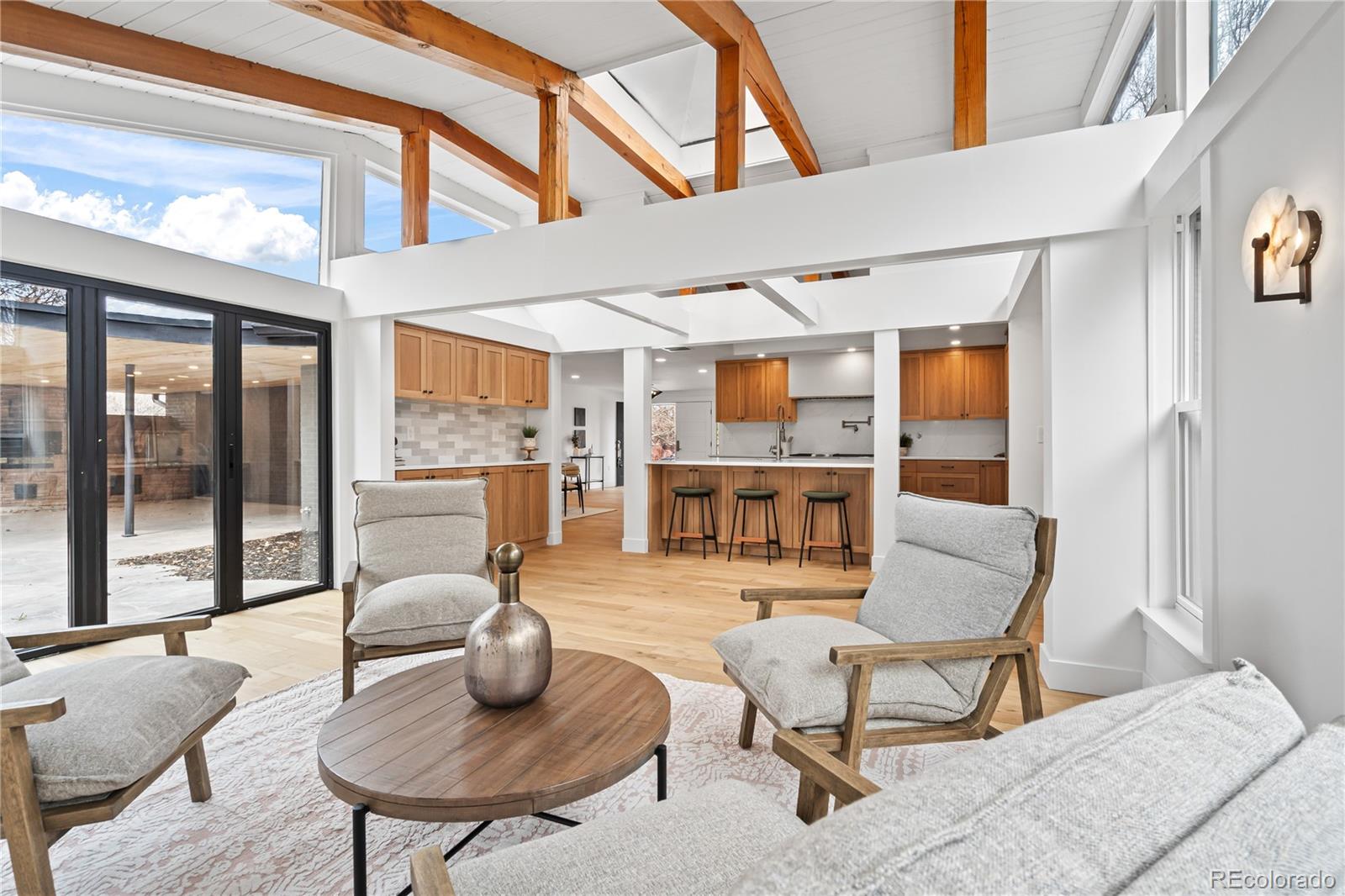 Stunning fully renovated luxury residence in the heart of Denver’s coveted Hilltop neighborhood. This expansive 4,000 sq ft home has been thoughtfully redesigned with elevated finishes throughout, featuring brand-new white oak custom cabinetry, high-end appliances, and beautifully curated materials at every turn. Wide-plank hardwood floors anchor the main living spaces, complemented by plush new carpet in the bedrooms and spa-inspired luxury bathrooms that feel straight out of a five-star retreat.Situated on one of the largest lots in all of Hilltop, the property offers rare outdoor space with a fully fenced yard—perfect for entertaining, privacy, or future customization. Every detail of this renovation was executed with sophistication and longevity in mind, blending modern luxury with timeless design. Prime central Denver location with close proximity to top dining, shopping, parks, and everything the city has to offer. A truly exceptional home that combines scale, style, and location.