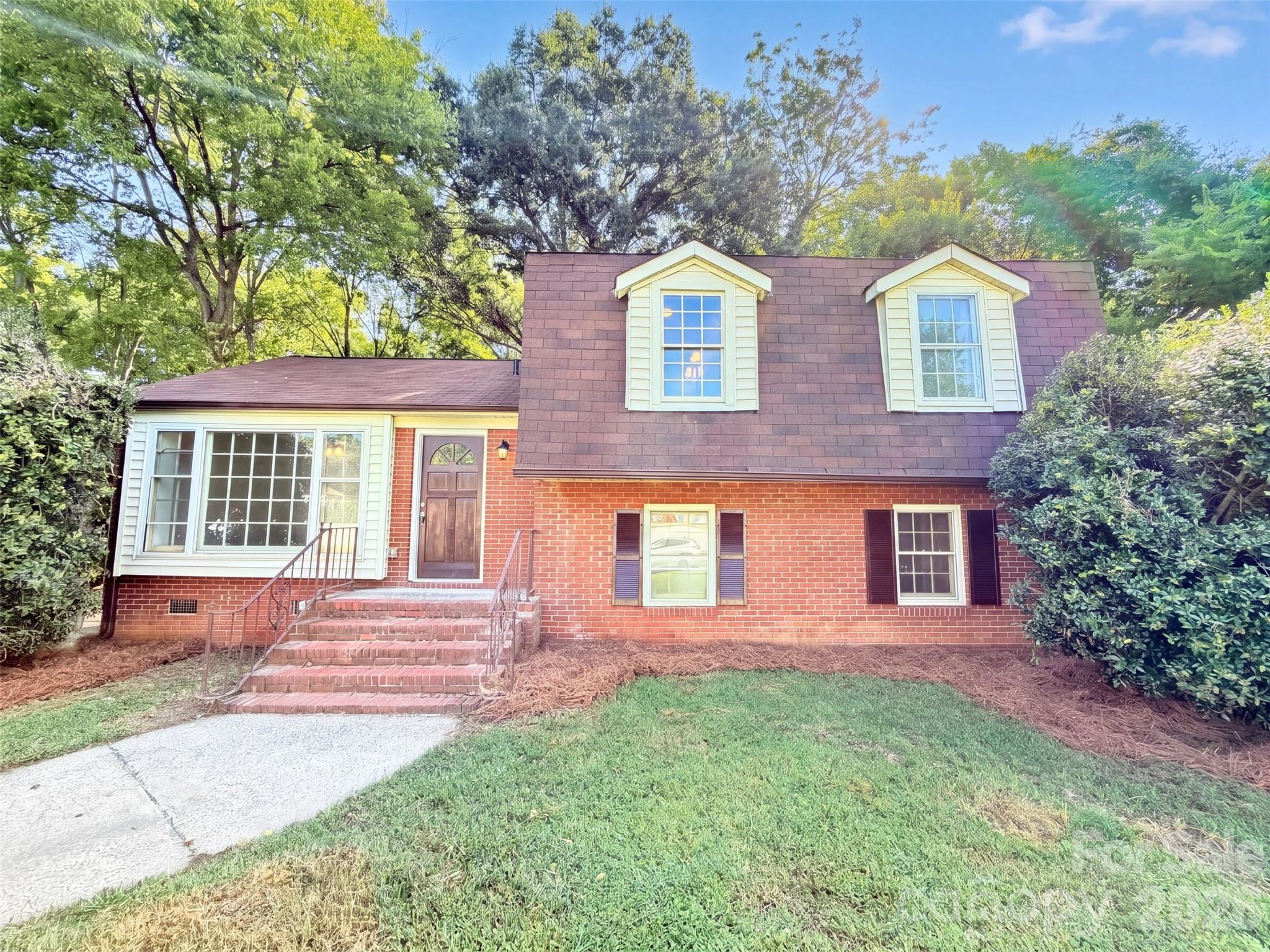 2717 O Hara Dr is a Charlotte split-level home set on a large, wooded lot with mature trees. The kitchen features white cabinetry, generous counter space, and stainless steel appliances, opening to the main living area with luxury vinyl plank flooring. Multiple living levels provide flexible layouts, including a bright gathering room with abundant natural light. The primary bedroom pairs with a bathroom that includes a double vanity, while additional well-proportioned bedrooms and a second full bath offer comfortable accommodations. Clean interior finishes carry throughout the home, and the expansive backyard backs to trees for a secluded, natural setting, completing this well-maintained residence with functional amenities throughout every room. Included 100-Day Home Warranty with buyer activation