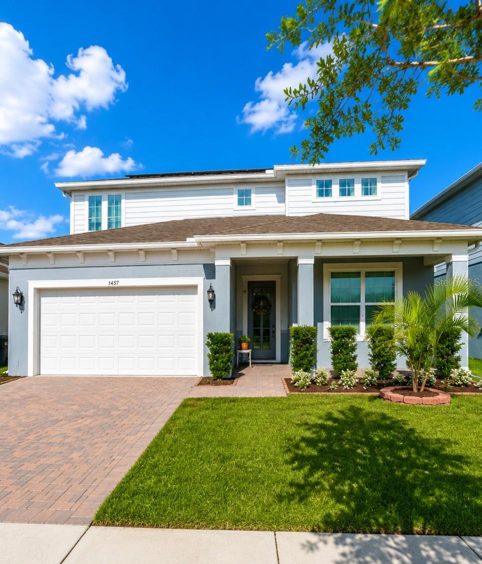 MOTIVATED SELLER-Here's the revised version:Welcome to this stunning, nearly-new residence at 1457 Grand Palm Drive in the highly desirable Savannah Palms community of Alafaya, Orlando, Florida 32828. Built in 2023 by Pulte Homes, this beautifully maintained home offers approximately 3,464 square feet of thoughtfully designed living space featuring 5 bedrooms and 4.5–5 bathrooms — including three private ensuite bedrooms, with primary suites on both the main and upper levels. This rare layout provides exceptional flexibility for multi-generational living, guests, or a dedicated home office setup.The fully paid-off solar system (transferring at closing) keeps the average electric bill at just $38/month — an estimated savings of $2,000+ per year compared to typical area electric costs. Additional highlights include a 3-car epoxy-coated garage, whole-house water softener, and designer finishes throughout.Exceptionally well cared for and presented in pristine, move-in ready condition, this home offers an open-concept layout perfect for today's lifestyle and entertaining. Located just minutes from shopping, dining, top-rated schools, the University of Central Florida, Orlando International Airport, Waterford Lakes, and Avalon Park, it offers unbeatable convenience and easy access to beaches and major highways.A true gem in one of East Orlando's most sought-after communities, this energy-efficient home combines luxury, practicality, and low-maintenance living — ideal for families and professionals alike.