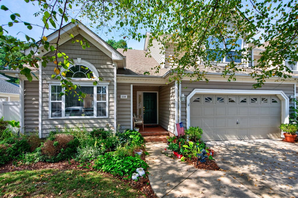Discover the ultimate in coastal resort living with this exceptional New Quarter carriage home at Bay Creek. Perfectly designed for effortless main-level living, the residence features a spacious first-floor primary suite, soaring vaulted ceilings, and a light-filled sunroom overlooking a serene, private wooded backdrop. Upstairs, a versatile loft and secondary guest quarters offer plenty of space for visitors. Kitchen features ample cherry cabinetry annnd stainless appliances. Premium finishes abound, including upgraded built-in cabinetry flanking the cozy fireplace and a fully integrated yard irrigation system.  Situated in a premier, golf-cart-friendly gated community, owners enjoy access to world-class amenities: a private beach, community pool, tennis courts, a signature golf course, pro shop, restaurant, a state-of-the-art fitness center, and miles of walking and biking trails. Located just minutes from the historic charm of Cape Charles and Kings Creek Marina, and a convenient 40-minute drive to Virginia Beach and Norfolk International Airport.