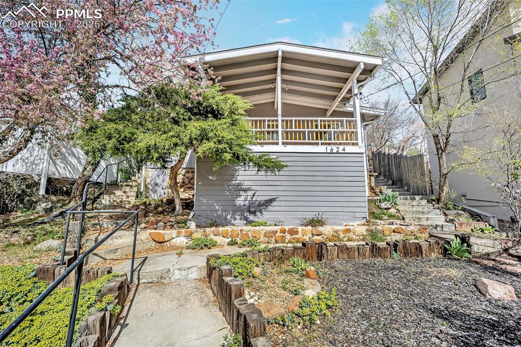 Discover the allure of this charming Canyon bungalow! Perfectly perched atop its lot, this delightful home offers both privacy and picturesque views that are sure to captivate. The inviting covered front deck serves as the ideal spot to immerse yourself in the beauty of the neighborhood. Inside, you'll find a well-maintained, modestly updated home that's ready for you to move right in. With upgraded flatwork throughout the property and thoughtful renovations this bungalow is a true gem. Outdoor enthusiasts will adore the entertaining possibilities it offers—beyond the welcoming front deck, the spacious side patio off the kitchen boasts a built-in brick BBQ, perfect for hosting memorable gatherings. The terraced and fenced backyard is ready to embrace your four-legged companions or satisfy the gardener in you. Enjoy the ease of living in this prime location, just a leisurely walk to a cozy local coffee shop or the sprawling 350-acre Stratton Open Space. This home offers flexibility to meet your unique needs. The oversized primary bedroom, formerly two separate rooms, provides a generous and peaceful retreat with endless opportunities to make it your own. The living and dining boast plenty of space to host guests or just retreat on snowy days. Finally, don't forget about the bonus room in the basement, while currently serving as laundry, this space can accommodate guests or serve as a private workspace. Come see it for yourself and take in the views!