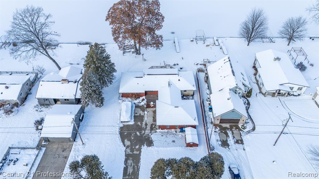 Dreaming of the perfect LAKE HOUSE? Welcome to Squaw Lake—an all-sports jewel on highly desirable Squaw Lake. This exceptional walkout ranch has direct access to a chain of lakes that include Lake Ponemah, Tupper Lake, and the Shiawassee River. This beautiful three-bedroom, two-bath walkout ranch is located in the highly sought-after Lake Fenton School District and is perfectly positioned for four-season recreation—from ice-skating and snowmobiling to summer boating and lakeside lounging. Enjoy endless possibilities for fishing, boating, kayaking, swimming, and ice skating. Spend summer evenings cruising by boat to a waterfront restaurant with live music or enjoy a peaceful paddle along the scenic Shiawassee River. Here, adventure and relaxation meet in every season!Step outside onto the expansive deck overlooking more than 100 feet of private lake frontage—a breathtaking setting/stunning lot  perfect for summer gatherings, quiet morning coffee, or simply taking in the tranquility of the water. Multiple outdoor patio spaces/walkout allow you to savor the outdoors from every angle.Inside, this home features a stunning open-concept floor plan with panoramic lake views from EVERY SINGLE WINDOW in the home. Whether you’re hosting, relaxing, or working from home, the sparkling water is always in sight. In the evenings, unwind as unforgettable sunsets stretch across the horizon, filling the home with golden light.Conveniently located just minutes from US-23 and the restaurants, shops, and amenities of Fenton and Linden,  this home offers the perfect balance of lakeside serenity and modern convenience.Don’t miss this rare opportunity—embrace the beauty, the lifestyle, and the unforgettable experience of true lakefront living.