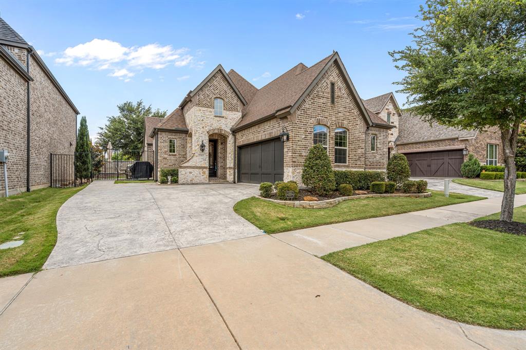Nestled on a cul-de-sac street in the highly sought after Village at Twin Creeks, this exceptional American Legend home offers an impressive blend of luxury, craftsmanship and low-maintenance living. Thoughtfully designed with quality upgrades throughout, the open concept floor plan showcases nail down hand-scraped hardwood floors, soaring vaulted ceilings, striking beam details and elegant 8 ft solid core doors. The gourmet kitchen is a chef’s dream, featuring a KitchenAid 6 burner commercial style gas cooktop, granite countertops, glass front upper cabinetry and seamless flow into the spacious family and dining areas, perfect for entertaining. The dining room is enhanced by a custom maple built-in dry bar creating the ideal space for serving cocktails, coffee, or refreshments with ease. Private study with French doors provides an ideal work from home retreat. The thoughtfully designed split bedroom layout includes a private secondary suite with an ensuite bath featuring a glass walk-in shower, offering comfort and privacy for guests. The serene primary suite features vaulted ceilings and a spa inspired bath complete with a frameless glass shower, deep soaking tub and walk-in closet with built-in organization. Outdoor living is equally impressive with a covered patio accented by a pine beadboard ceiling, built-in speakers, extended stamped concrete, turf, and river rock landscaping, creating a beautiful lock-and-leave outdoor retreat. Front yard maintenance is included in the HOA, allowing for truly effortless living. Oversized garage with epoxy flooring and a fully decked attic above, provides an abundance of storage rarely found in similar homes. Ideally located near shopping, dining and the Allen trail system, residents also enjoy access to outstanding community amenities, including a resort style pool, fitness center and clubhouse. This is a rare opportunity to enjoy luxury, convenience and an easy-care lifestyle in one of Allen’s most desirable communities.