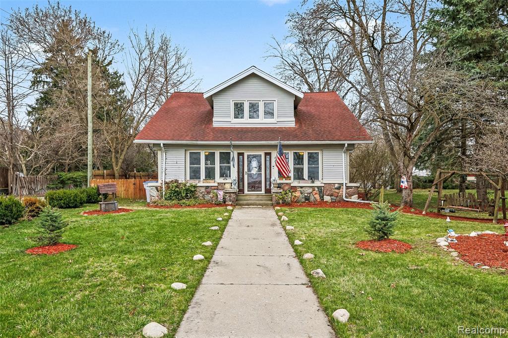 Discover a blend of comfort, character, and year-round recreation in this 5-bedroom, 2 full bath, 2 half bath waterfront home boasting 105 feet of pristine frontage on all-sports Whitmore Lake. Perfectly designed for lake living, this property offers unmatched amenities, timeless finishes, and multiple spaces crafted for comfort and entertaining. Step inside to find Italian travertine stone flooring, natural wood parquet, and beautiful marble counters throughout the custom chef’s kitchen. The open-concept culinary space features custom cabinetry, a gas stove, tile backsplash, granite counters, and stainless steel appliances, all arranged with a thoughtful, highly functional layout. A brand-new, fully custom pantry room elevates storage and organization to an entirely new level. Large windows fill the home with abundant natural light and frame stunning water views, while updated tile bathrooms, a convenient first-floor laundry, mudroom, and a charming three-season entry room add function and warmth to the home’s inviting character. The property is ideal for outdoor living with a large yard, detached 3- car garage, new perimeter fence, new water heater, and an aluminum dock—ready for your boat from day one. Electricity and water at the lakefront make outdoor entertaining and maintenance effortless. The lake-side lot is build-out capable, offering exciting potential for future expansion. Perfect for swimming, with shallow, child-friendly waters, this home also delivers four-season fun—from boating and summer recreation to ice fishing and winter sports. This is more than a home; it’s a year-round lakefront lifestyle filled with charm, modern comforts, and unforgettable views. Come experience Whitmore Lake living at its finest.