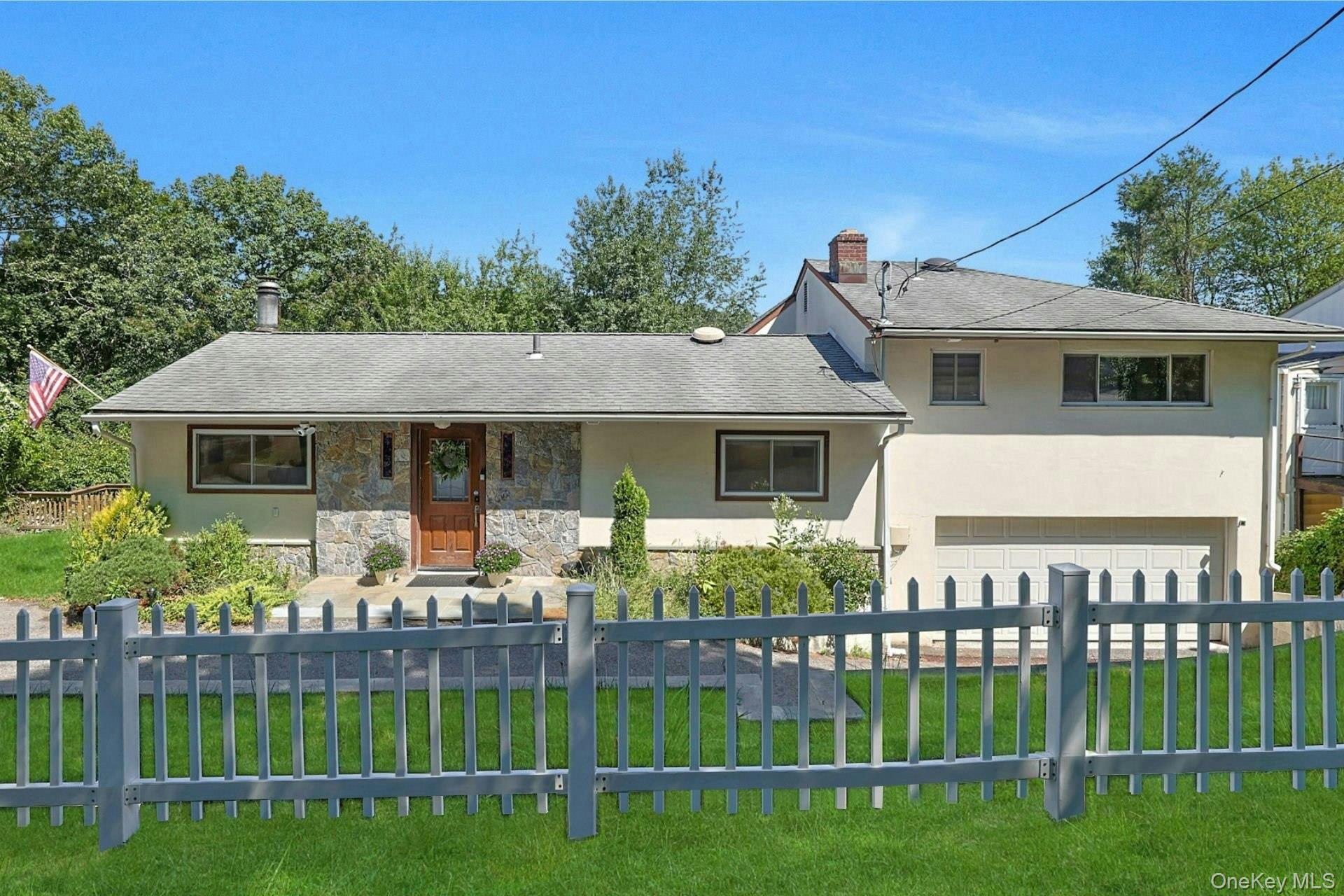 Move-in ready four-bedroom, three-bathroom split level home located in Tarrytown's quaint Pennybridge neighborhood, and within the highly sought after Irvington School District. The no-step entrance to the main level offers an open floorplan, including a Living Room with wood burning fireplace, Dining Area, and Kitchen with an eat-in dining counter and plenty of storage. Also located on the main level is a fourth bedroom, perfect for multi-generational living, a guest room, or home office - plus a full hall bathroom. A few steps up to the bedroom level, you will find the Ensuite Primary Bedroom, plus two additional bedrooms (one currently used as a home office). Head down to the lower level to enjoy game/movie night in the large yet cozy walk-out Family Room - there is also a Sitting Room, Powder Room, and Laundry Room on this level. This three-level home offers a flexible layout, ideal for those who work-from-home or otherwise need quiet spaces. Throughout the home, you will appreciate the many smart home features, new appliances, recently installed hardwood floors on the bedroom level, lighting and bathroom updates/upgrades, and much more! Like to entertain? This home offers amazing outdoor space including an expansive deck off the Kitchen/Dining Area, a balcony with views of the Castle, a large lower-level patio, and a fenced-in backyard with playground. Completing the picture is a two-car garage, with extra durable epoxy chip flooring, and an ample driveway providing plenty of parking for family and friends. The best-of-both-worlds location of the home offers the ability to seamlessly enjoy what both villages have to offer: Farmer’s Markets, Street Fairs, Taxter Ridge Nature Preserve (in the neighborhood), the historic Lyndhurst Estate Grounds, and Waterfront Parks/Trails. Perfect for the commuter with parkways and highways just minutes away, and resident access to the Tarrytown Metro-North Train Station offering quick and scenic express service into NYC. Taxes noted do not include the NYS STAR Tax savings of $1,521.