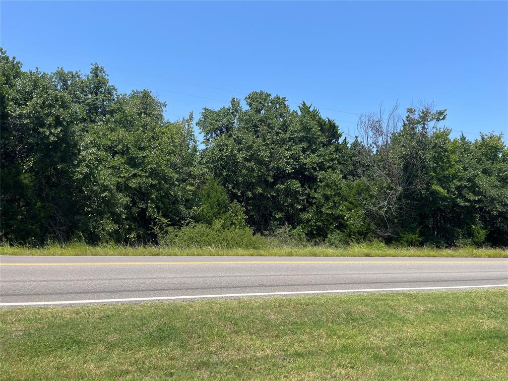 HEAVILY WOODED TRACT WITH OLD GROWTH HARD WOOD TREES.THIS PROPERTY WOULD ONLY BE SOLD IN CONJUNCTION WITH A NEW CUSTOM HOME USING RYAN KANALY HOMES, INC. AS THE BUILDER.NOTE:  AS SHOWN ON THE PLAT, THE OIL WELL SERVICE LINE AND OIL WELL SERVICE ROAD EASEMENT TO THE BACK OF THE PROPERTY HAVE  BEEN VACATED BY THE OIL COMPANY.  SEE PLAT MAP ATTACHMENT IN SUPPLIMENTS.