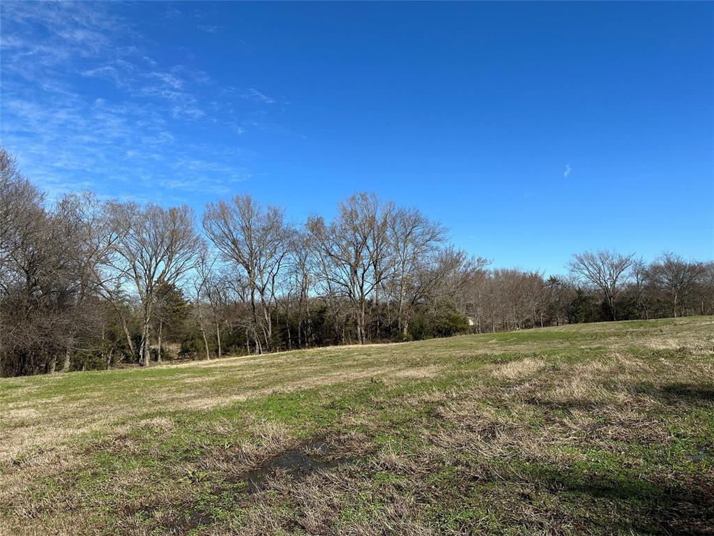 Unrestricted, this 18.762 acres with utilities at road gives you options as a homesite or as a hobby farm or both. Property includes one pond and ten acres in pasture grass. Surrounded by rural acreage tracts, this spot gives you scenic country views and enough space to add a workshop, raise livestock, or use for hay production. Buyer will need to verify utilities. This tract is in desirable sandy soil and is already established with common bermuda grass. All this in the award-winning Como-Pickton school district. So much potential as a homestead and small ranch!  Please do not drive on the property after heavy rains.  You may walk or take an ATV.