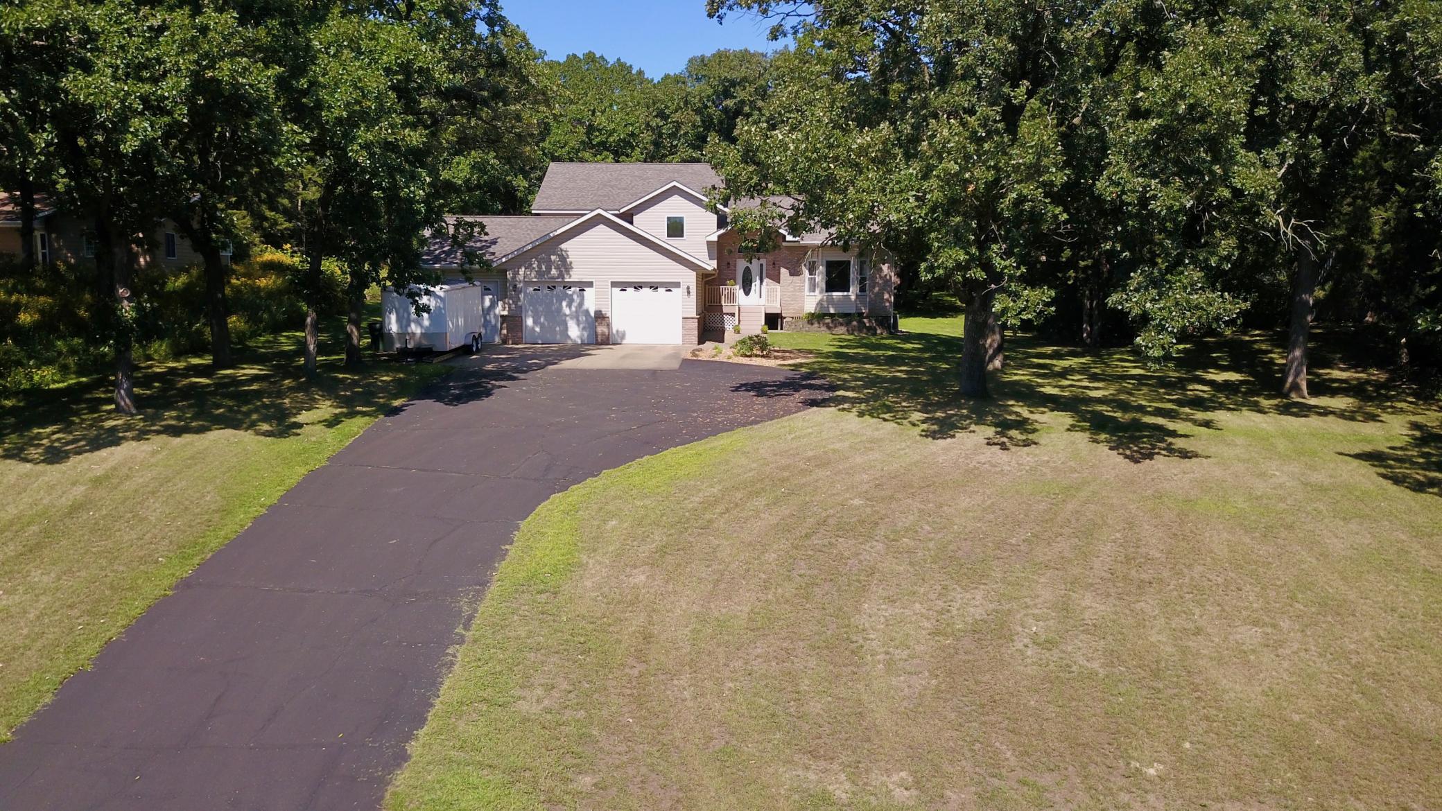 Welcome home to this spacious 4-bedroom, 3-bath modified multi-level home located just outside of town! Proudly offered by the original owner, who is also a builder, this home has been thoughtfully built and well cared for over the years. The main level offers a comfortable and inviting layout with a dining area that opens to a great maintenance-free deck—perfect for relaxing or entertaining. Just off the family room, you’ll find a patio that provides even more outdoor living space. Upstairs, you’ll find three bedrooms, including a spacious primary suite with an updated private bathroom and its own small deck. Imagine enjoying your morning coffee while taking in the peaceful view of the wooded backyard! Bedroom 4 is currently set up as an office, providing a flexible space for working from home, hobbies, or guests. Numerous updates add peace of mind, including a new roof and updated windows throughout much of the home. With plenty of living space, multiple outdoor areas, and a private wooded setting, this home offers the perfect combination of comfort and convenience just minutes from town.