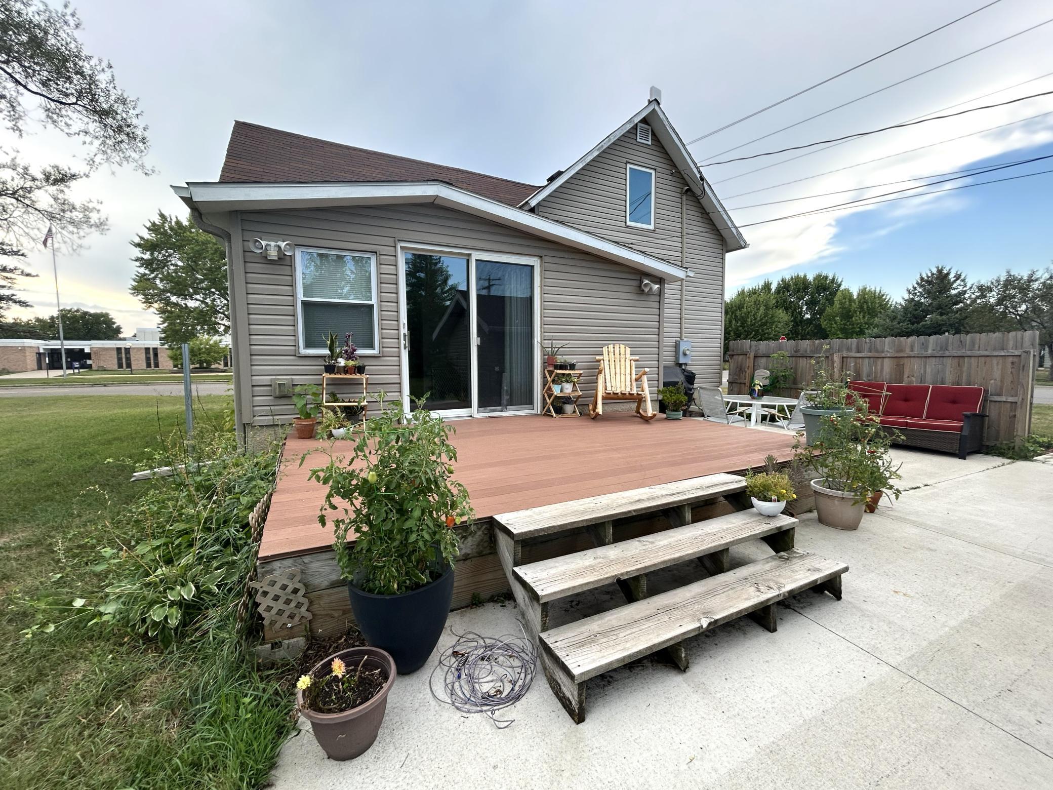 Welcome to this charming and beautifully updated home, ideally situated on a spacious 0.413 acre triple city lot. Filled with character and thoughtful updates, this home features hardwood floors, granite countertops, and beadboard ceilings, creating a warm and inviting atmosphere. Enjoy the convenience of main-level living along with the peace of mind provided by many newer windows, nearly new washer and dryer (2026), maintenance-free siding and decking, a newer furnace, and updated electrical. A wonderful combination of charm, functionality, and desirable updates in a great setting. As an added bonus, the stylish dining room coffee bar, hutch, and table & chairs may stay! Don't miss your opportunity to see this one - schedule your showing today!