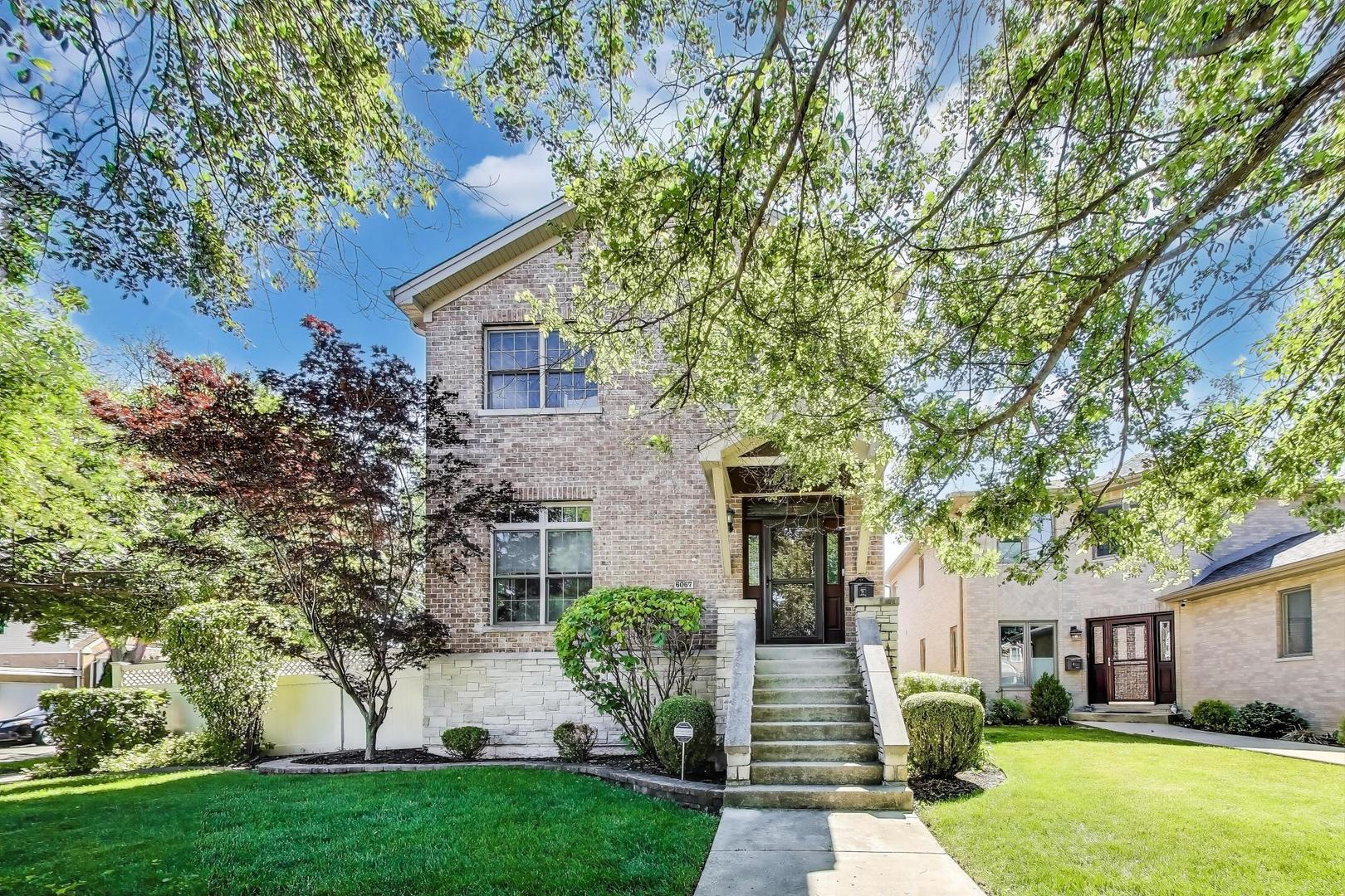 This stunning 4-bed, 3.5-bath brick home on a spacious corner lot offers exceptional craftsmanship and high-end details throughout. The open layout features a grand foyer, bright living and dining rooms, a chef's kitchen with stainless steel appliances and breakfast bar, all overlooking a cozy first-floor family room with fireplace. Sliding glass doors lead to a beautiful deck and expansive private yard, complete with a massive brick paver patio, fire pit, and heated pool in a fully enclosed yard. The home also includes a wide side drive (fit for 2 cars) and a 2.5-car garage. The master suite is a true retreat with vaulted ceilings, a spa-like bathroom, and a walk-in closet, while the lower level boasts a large recreation room and a restaurant-quality bar, perfect for entertaining. Designer touches throughout include crown molding, custom fireplace, coved lighting, upgraded baseboards and trim, solid-core doors, and hardwood floors. Additional features include zoned HVAC, a sump pump, and more. Located in the highly-rated Edison Park School District, just a short walk to both the Blue Line and Metra for easy commuting, this home has it all.