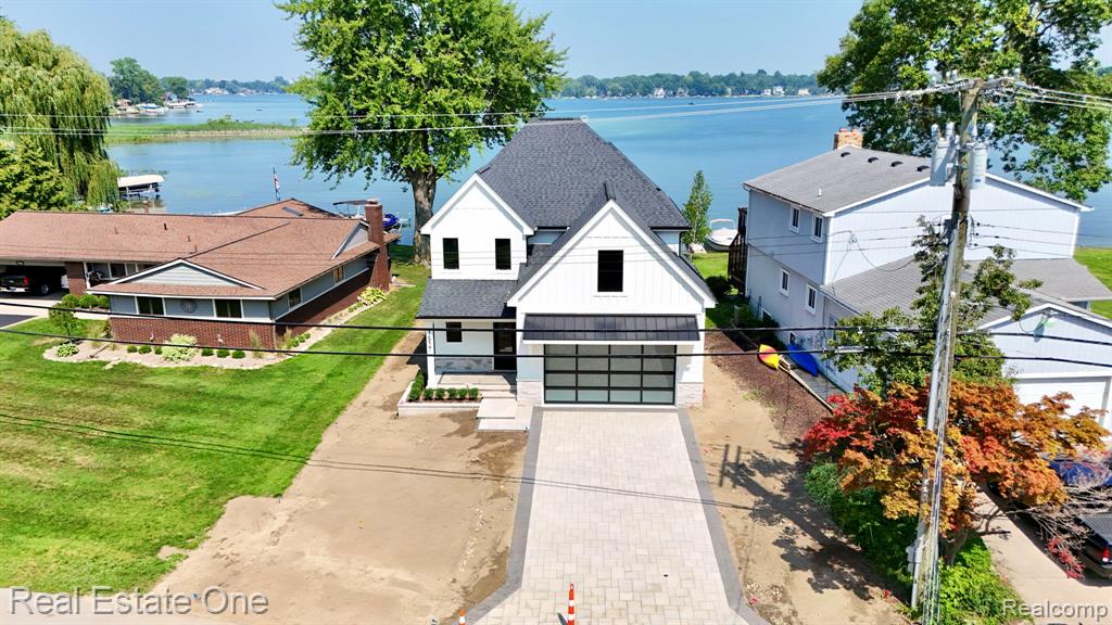 Enjoy beautiful lakefront living in this brand-new 4-bedroom, 2.5-bathroom home on All Sports Sylvan Lake. This custom-built home features high-end finishes throughout and an open layout designed for modern living. With the backyard facing east, you’ll wake up to stunning sunrises and enjoy peaceful lake views all day long. The kitchen offers premium appliances, custom cabinets, and elegant countertops—perfect for cooking and entertaining. The spacious primary suite includes a luxurious bathroom, and three additional bedrooms provide plenty of room for family or guests. Step outside to your private backyard with direct lake access and a great space for relaxing or entertaining. A rare opportunity to own a custom new construction lakefront home. Schedule your tour today!