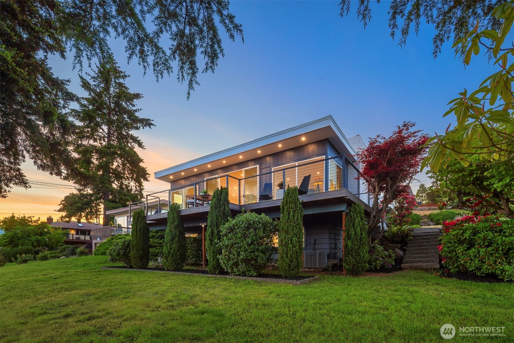 Turnkey Mid-Century Modern in coveted Shorewood on the Sound. Situated on a Generous Corner Lot, the Home has been Fully Re-Imagined from Top to Bottom. Refined Living Spaces amongst Breathtaking Puget Sound Views. The Open Concept Living Area is Light and Bright with Walls of Windows. Natural Hardwood Flooring and a sleek Tiled Fireplace complete the Vibe. Stylish Chef’s Kitchen features Quartz Countertops, Stainless Appliances, Magnificent Cabinetry and a Massive Island. The generous Lower-Level Primary Bedroom exudes Style and Comfort. Amidst water views and a Cozy Fireplace lies the Ultimate Setting for Peace and Tranquility. The Stunning En-Suite Bath is a Masterpiece with its Oversized Shower and Tub, Heated Floors and Breathtaking Tile Work. The adjacent Private Office, Walk In Closet and Laundry Quarters complete the package with Functionality and Convenience. This isn't simply an extraordinary home: It’s An Experience You Won’t Want to Miss! Pre-Inspected