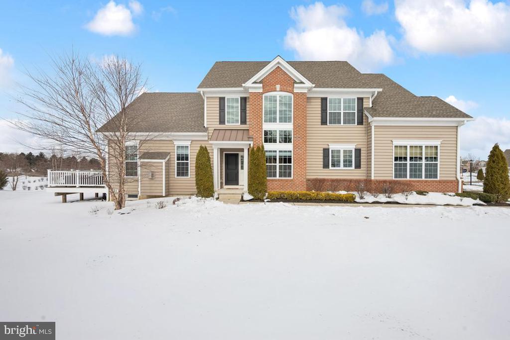 Highly sought after yet rarely available, sun filled end unit with custom fit and finish throughout.  This modern, well equipped carriage home in The Mews at Laurel Creek is both inviting and elegant.  The owners have meticulously cared for and improved this newer (2018) Bristol model offering 3 bedrooms and 3.5 bathrooms plus bonus room.  The kitchen showcases high end Quartz countertops, stacked cabinetry, farmhouse sink, Jenn-Air commercial style appliances, and volume ceiling in the breakfast room.  Wide plank hardwood floors grace the 1st floor and 2nd floor loft.  The primary suite with walkout bay window extension option takes advantage of unobstructed nature views.  Custom light fixtures, upgraded tile, countertops, fixtures and trim work, designer wallpaper and Hunter Douglas window treatments are found throughout this home.  An above par finished basement with high ceilings features a layout to suit any lifestyle including family room with state of the art, electric fireplace set in stacked stone, office, workout and lounge areas, bonus room and a palatial full bathroom plus ample storage space!  Not to be overlooked…the landscape views from the unique position of this home which are readily enjoyed from the composite, low-maintenance deck.  The community clubhouse offers grand entertainment space plus breakout rooms for games and gatherings, fitness center, heated pool, bocce and putting green.  You are a short walk from Moorestown’s beloved Farmer’s market (buy the sourdough bread!) and Laurel Creek Country Club with 18-hole Championship Golf Course designed by Arnold Palmer.  The HOA handles exterior building maintenance, landscaping and snow removal.  This is your chance to simplify without sacrifice!