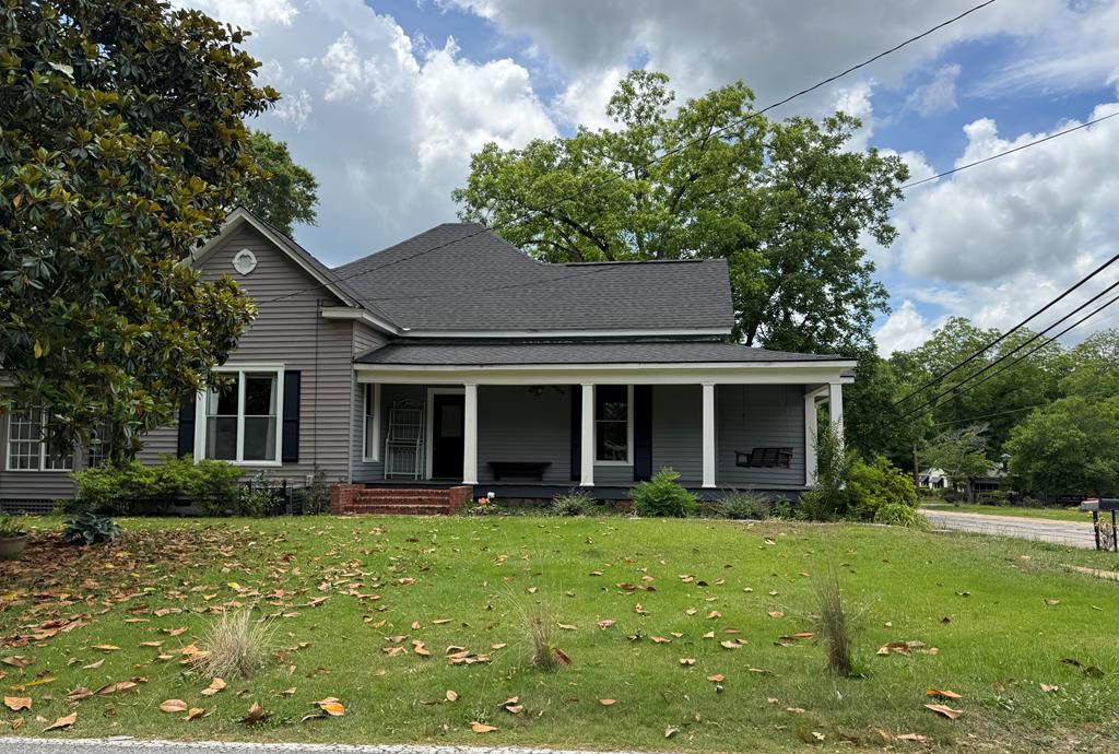 Downtown Pine Mountain historic home within walking distance to shops and restaurants, and the Man O'War recreation trail! Roof is two years young and HVACs and water heater are newer.  Enjoy the classic front porch, some original wood floors and updated kitchen.  Nice fenced yard with storage building and covered parking.  City water and sewer! All electric.  Make this your home in charming Pine Mountain!