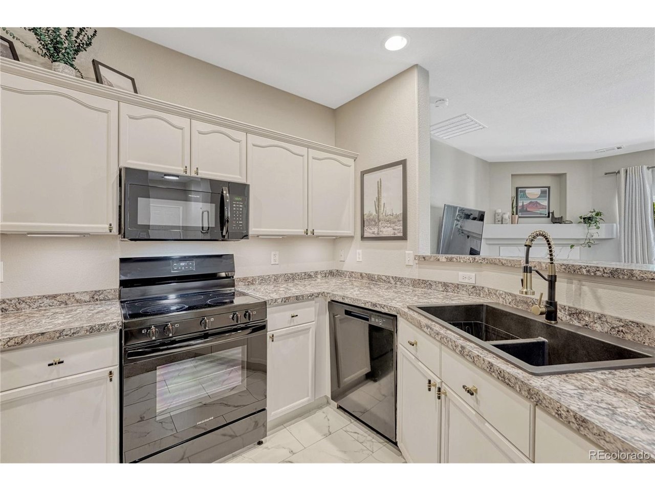 Welcome to this move-in-ready private and secluded gem in Littleton's Mountain Gate III community! Ground level living simplifies life while still allowing enjoyment of the maintained grounds and a gated pool. Completely remodeled, the interior features nearly 9' ceilings that brings in natural light to the open-concept living area along with the south facingsliding door that opens up to thepatio offers a wonderful mountain view and beautiful sunsets.This condo feels larger than its square footage due to an ideal floorplan. Bedrooms are well-separated by the spacious living room, kitchen and dedicated dining space between. Each bedroom has a walk-in closet. The en suite primary bathroom features dual vanities, tile flooring, and a large oval tub. The secondary 3/4 bathroom, adjacent to the second bedroom hasa shower making it ideal for guests, in laws, or convenient to your new home office. A cozy gas fireplace anchors the living room, which the kitchen overlooks. The kitchen has a new sink, microwave, oven and refrigerator along with spacious cabinets that allows for family interaction and entertaining.The laundry closet accommodates the 2024 full-sized washer and dryer that are included. Besides the additional locked storage found right off the patio, one of this home's best features is the deeded detached garage, which is 20 feet deep and includes more shelving! The furnace was replaced in 2024, new water heater in 2025. No detail has been overlooked - new ceiling fans, countertops, sink hardware, showerheads, tiling around the fireplace....did we mention that this is a stress free move-in-ready home?!? Owning this condo means you are part of the Ken Caryl Ranch community, granting you access to the gated pool,tennis courts, recreation centers, activities and nearby trails. Less than two minutes away from C-470, it is easy to head up to the mountains, downtown and DTC. This one is just waiting for you!