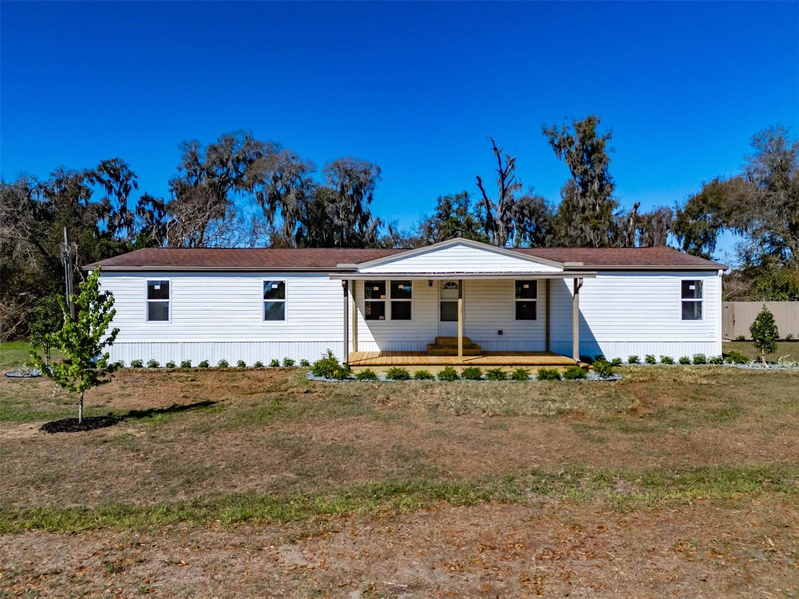 This 4 bedroom 2 bath home sits on almost 1 acre of land. The home is fully renovated with all new drywall, all new luxury vinyl flooring, new kitchen cabinets, quartz countertops, island with seating, all new appliances and a built in pantry. This home offers a large open living space with a separate dining room. The split floorplan offers privacy. You'll find the primary bedroom and bathroom off the main living space. The primary bathroom has an oversized walk in shower, dual sinks, open shelving for storage and the primary closet. Down the hallway, you'll find a spacious laundry room with cabinetry for storage. You'll find the completely updated second bathroom and 3 additional bedrooms. This home has a new septic system (drain field & tank) and a new well pump. This home in the country won't last. Schedule your showing today!