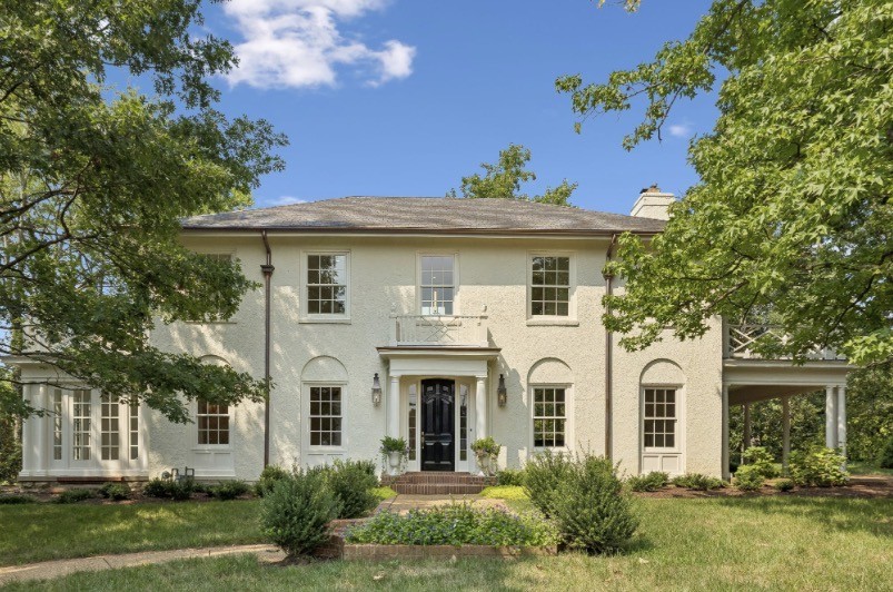 A beautifully appointed signature Belle Meade estate, reimagined by renowned architect Ron Farris. The extensive renovation seamlessly blends timeless architecture with contemporary luxury, creating an exceptional residence for the modern family. The chef's kitchen is appointed with custom Mauser cabinetry and Calacatta marble countertops accented by unlacquered brass hardware. The elegantly conceived living spaces are crafted for both comfort and sophisticated entertaining, with seamless transitions between refined indoor settings and gracious outdoor areas. The reimagined baths are dressed in Carrara marble, while the primary suite offers an antique fireplace and his-and-hers dressing rooms custom-designed by California Closets. Every detail has been considered — the home features entirely new systems, including HVAC, plumbing, and electrical, along with a new roof, copper gutters, updated insulation, and irrigation. Home features a park like 1.1 acres is located on a quiet street.