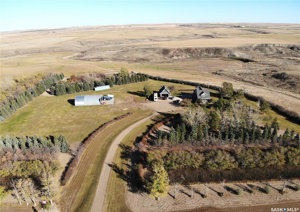 Check out this unique property with a Half-section of land of high-quality farmland, with a coulee running through the west side of the property. A large, landscaped yard with a character home, and outbuildings located in the RM of Arlington No. 79,  This property is close to the town of Shaunavon for all your amenities. A great place to raise to call home, raise a family or escape the city for your own place to explore southwestern Saskatchewan. 
The property boasts a large yard, beautifully landscaped with mature trees, shrubs, and meticulously manicured grass(underground sprinklers). This expansive area offers ample room for outdoor recreation, gardening, or future development, making it ideal for families, and anyone who enjoys entertaining guests. Lots of privacy to enjoy rural life.
On the yard, there is a 40 x 60 shop and a 36 x 24 garage with a loft, along with exterior features such as east-facing deck, patio and a balcony off the primary bedroom. You can enjoy scenic evenings on the spacious deck measuring 34 x 28 or relax on the west-facing veranda. The home is equipped with both propane and electric heating system along with two fireplaces. 
The modern kitchen features an island, abundant cabinetry and stainless-steel appliances such as a refrigerator, stove, over-the-range microwave, and dishwasher. Inside, you'll find four bedrooms, including a primary suite complete with an ensuite bathroom and walk-in closet. Original woodwork doors and trims add character, complemented by an authentic claw-foot tub
A large porch connects to a utility area and bathroom for added convenience. The lower level provides considerable living space, featuring a spacious family room, open areas perfect for a gym or office setup, and a generously sized bathroom with a walk-in shower.
Book your showing today!