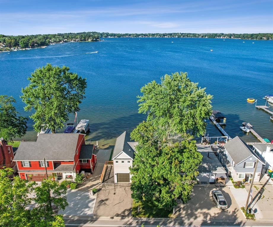 The BENEFIT of this Whitmore Lake Waterfront Treasure...The BENEFIT of this Whitmore Lake Waterfront Treasure - Updated Improved Well-Maintained Historic Home... Located in Whitmore Lake, this home offers direct private all sports lake access with panoramic views of Whitmore Lake. Situated on an excellent lot with easternly views, sandy beach, and walkable to downtown Whitmore Lake, this home offers everything you desire in a lakefront living.  3 bedrooms (one is situated in a way that offers a very private master suite, quest, or in-law quarters), 3 Full Baths, walkout basement, attached garage with service door, driveway allows spaces for at least 3 more vehicles, large deck spanning entire width of home, patio, extra parking pad, and so much more.  The updated craftsman like finishes provide a warm cozy feel to the already comfort of lakefront living.  Originally 100-year-old plush hardwood flooring is in impeccable condition and complemented by the many updates and improvements.  All appliances included, newer Lennox furnace with Wi-Fi controls, and multiple A/C units for zoned comfort.  You will be able to move right in and start enjoying the much sought after lake life. The serenity of the water and sunrise views from many rooms throughout the home, yet easy access to highways for elegant dinners out.  Whether in downtown Ann Arbor or Brighton, these nearby areas are just 10 minutes away.  Do you like to entertain?  Nothing like a party on the lake.  Be the place to celebrate all occasions; birthdays, holidays, University of Michigan Games, Tigers, Lions, Redwings, Pistons and more.  Whether you plan to live the lake life year-round, enjoy your up north cottage yet only minutes away, or use the house as an investment property, this is the perfect property for any option.  While the super clear spring fed all sports lake is outstanding during the warmer months, Whitmore is also great during the winter months where you can enjoy skating, organized hockey, ice fishing and more.  You have found a rare opportuni