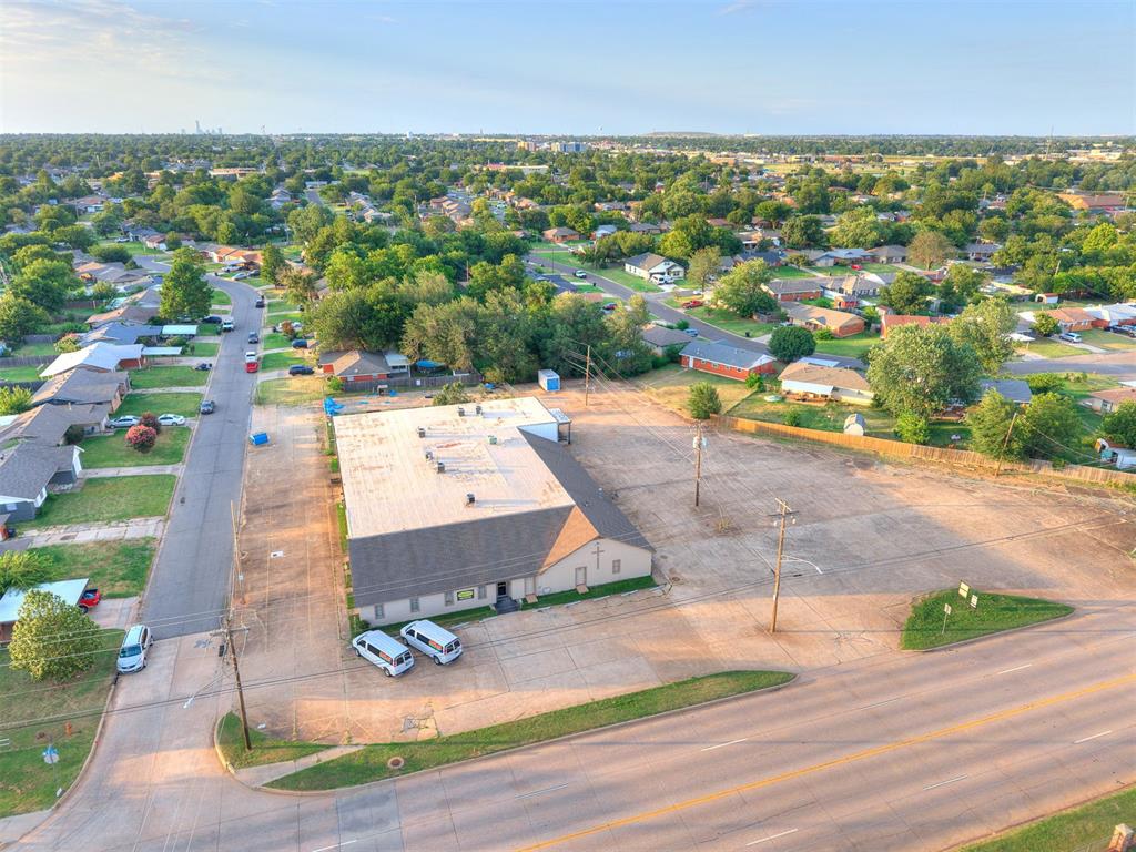 Incredible location with appx. 300 ft. of frontage on SW 4th St. in Moore and access to I-35 less than 2 miles to the east!  Use it as is or re-develop it! ZONED R-2 allowing for two-family dwellings along with low impact institutional such as churches or schools. 1.23 acres of land includes 89 asphalt paved parking spaces and an 18,015 s.f building with the ground floor being 11,980. The building has recently been used as church and a daycare. Constructed in 1980 and renovovated in 2000. Existing improvements include a sanctuary with seating for 250 people, a fully operating kitchen, 25 rooms downstairs, 14 rooms upstairs, 7 mens/womens bathrooms with 2 being ADA, 2 showers, and 2 large above-ground storm shelters
