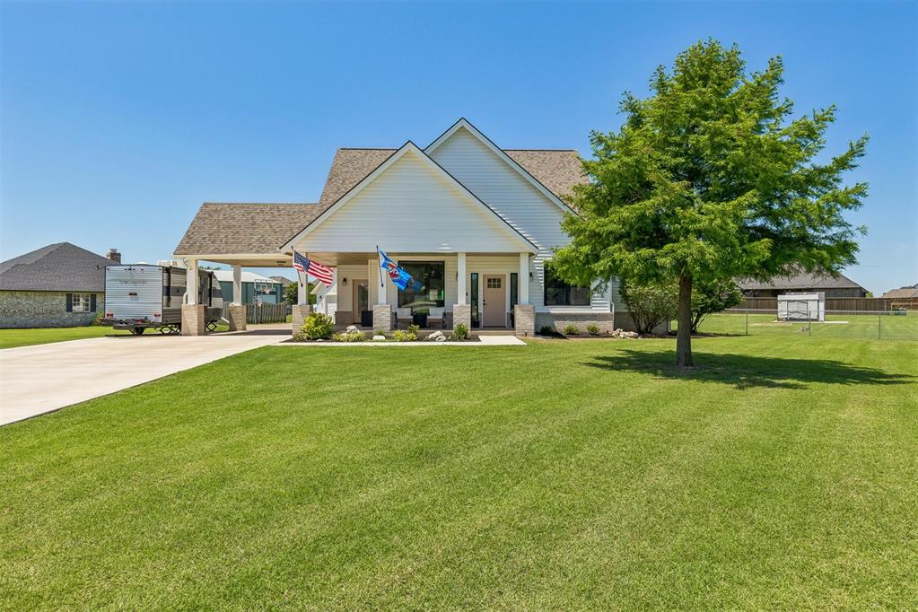 Looking for a little slice of heaven tucked away in a peaceful setting, yet just minutes from shopping and easy access to I-35? This is the one!All the work has already been done—just move in and enjoy. This charming farmhouse-style home features an adorable covered front porch, the perfect spot to relax with your morning coffee.From the moment you step through the front door, you'll notice how exceptionally well cared for this home has been. Pride of ownership is evident throughout. The wonderful open-concept floor plan offers a spacious living area that flows seamlessly into the expansive kitchen, complete with a corner pantry and convenient breakfast bar.Abundant windows throughout the home fill every room with natural light. In addition to the generous dining area, you'll find a versatile flex room at the back of the home overlooking the large covered patio and beautiful backyard—ideal for a home office, playroom, or second living space. All bedrooms are generously sized, including the spacious primary suite with its private bath. Numerous updates have been completed since the current owners purchased the home. A complete list of improvements from 2017–2025 is available in the attachments, but highlights include all new windows and exterior doors, a back patio awning, new HVAC units, reworked and sealed attic ductwork, an extended concrete driveway to the street, a new garage door, and new exterior brick.This darling home is truly move-in ready and one you won't want to miss!