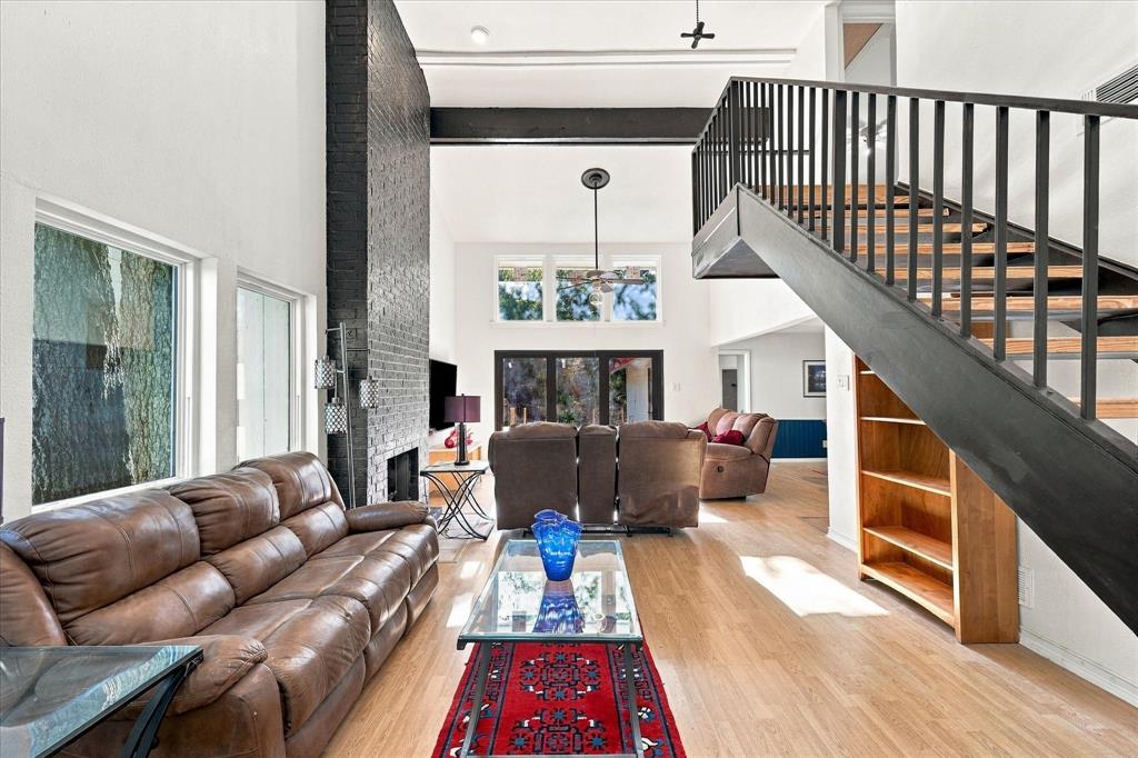 Just seven miles from downtown Dallas, this home defies expectations from the moment you arrive.  A 2-car garage separates the home from Royal Ln, buffering traffic noise and creating an unexpected sense of tranquility. Step inside to soaring ceilings, abundant natural light, and a living room that opens through expansive 3-panel doors to your own nature preserve.  The dramatic 2-story living room gives way to more intimate kitchen and dining areas, each with its own distinct character while remaining visually connected. Beyond the backyard, a creek, wooded greenway, and bamboo forest bring nature to your doorstep, creating an extraordinary sense of privacy with no homes directly behind you. Dallas's famous green parrots regularly fly overhead. The private courtyard creates a natural extension of the interior, perfect for morning coffee or evening gatherings.  Inside, the spacious primary suite features a spa-inspired bathroom with an oversized soaking tub, modern Japanese-style toilet, and a generous new skylight integrated into a richly textured natural wood ceiling. Cedar-lined closets add another thoughtful touch.  All three bedrooms comfortably accommodate king-size beds. Throughout the home, extensive updates include new light fixtures, switches, outlets, vent covers, and door hardware, along with new baseboards throughout the downstairs. Major investments in newer windows, HVAC, and furnace provide added comfort, energy efficiency, and peace of mind; improvements that go well beyond cosmetic remodeling.The kitchen is designed for someone who actually loves to cook. Two modular sinks create dedicated food-prep and cleanup zones, improving workflow and making entertaining effortless. Custom artistic epoxy countertops evoke the rich movement of natural stone while providing a distinctive, easy-care surface.  More than simply a renovated home, it's an unexpected retreat where contemporary comforts and an extraordinary natural setting come together.