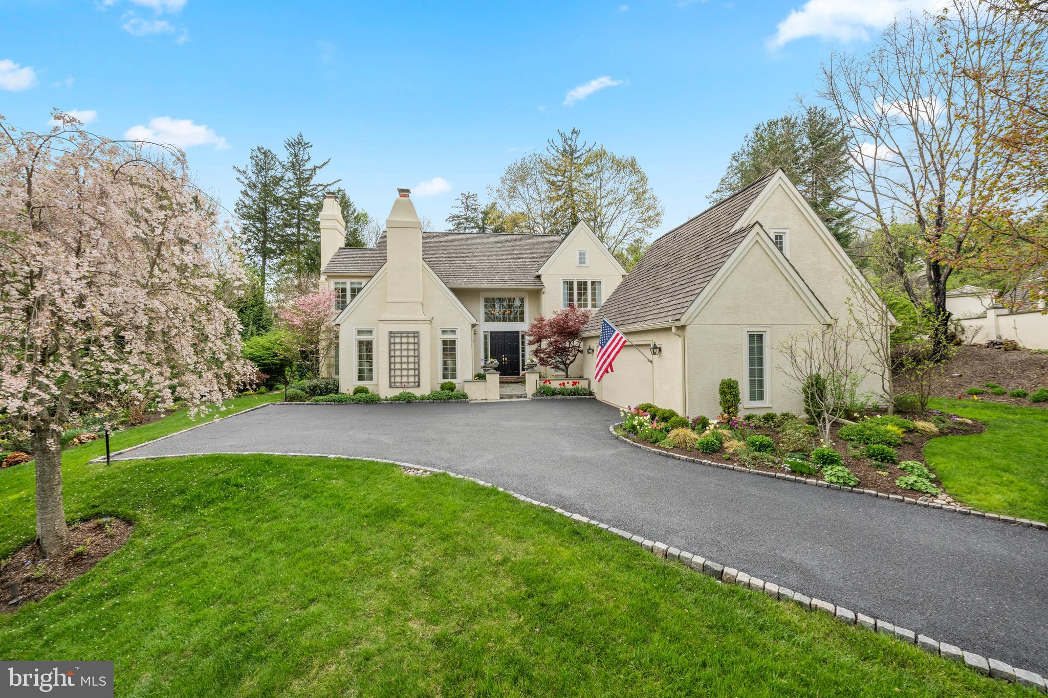 SUNDAY OPEN HOUSE CANCELLED.  The Denbigh home of your dreams is HERE — and it is spectacular. This top-to-bottom, fully renovated gem delivers the resort style living you’ve been waiting for in the heart the Main Line.  Step inside through a sun-filled two story foyer where gleaming hardwood floors stretch throughout every level.  The formal living room, anchored by one of four gas fireplaces, sets an elegant tone, while the adjacent den — with its own fireplace — provides the perfect retreat for quiet evenings at home.  Entertain in style: the oversized dining room flows effortlessly onto a private terrace with pool, spa, and water feature — your own tranquil escape, right out the back door. The gourmet kitchen is a showstopper: Quartz countertops, custom marble backsplash, Wolf range, custom hood, Sub Zero built-in fridge, microwave drawer, coffee bar, and island — all opening to a vaulted family room with stone fireplace and sliders to the pool. Powder and Laundry round out the main floor.  Upstairs, the primary suite is nothing short of a private retreat. Generous proportions, a custom walk-in closet designed to impress, and a marble bath that feels more like a luxury spa — featuring a deep soaking tub made for long unwinds, an oversized walk-in shower, and dual vanities with room to breathe. Two additional well-appointed bedrooms and a fully updated bathroom complete the upper level beautifully. Lower level brings additional entertaining space, wet bar, gym area, potential 4th bedroom, full bath, and cedar closet. The big stuff? Done. Stucco remediated. New windows. Roof inspected and certified. Custom window treatments throughout. Breezeway connecting to two car garage. Professional landscaping.  HOA handles snow, trash, and common areas. Bring your toothbrush — this one is ready.