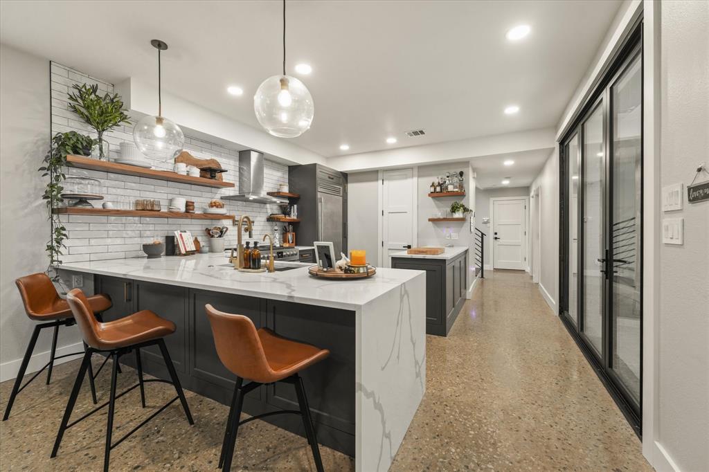 PFully renovated and move-in ready, this contemporary three-bedroom home blends clean modern design with warm, livable spaces in the heart of Lower Greenville. Soaring ceilings, polished concrete floors, designer lighting, and an architectural floating staircase create an impressive first impression, while abundant natural light fills each level.The chef's kitchen features quartz countertops, custom cabinetry, stainless steel appliances, a large entertaining island, and flows seamlessly into the open living and dining areas, making the home ideal for everyday living and hosting guests.The spacious primary suite offers a spa-inspired bath with a soaking tub, oversized glass shower, dual vanities, and a generous walk-in closet. Each secondary bedroom includes its own ensuite bath, providing privacy and flexibility for guests, roommates, or a home office.Enjoy a private fenced yard, covered patio, attached two-car garage, dedicated utility room, and multiple levels of thoughtfully designed living space.Located just blocks from Lower Greenville and Henderson Avenue, you'll enjoy some of Dallas' best restaurants, coffee shops, boutiques, and nightlife while still coming home to a quiet residential street. Zoned to highly sought-after Geneva Heights Elementary.