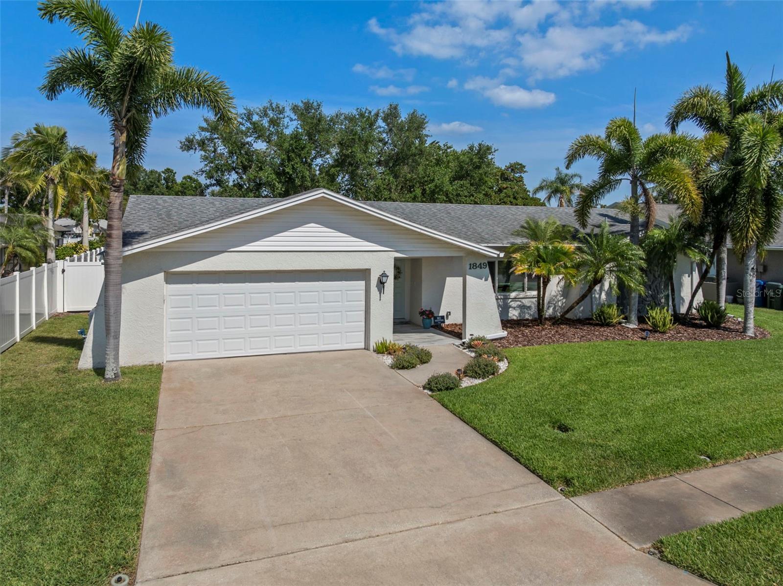 Located just minutes from Largo, a city that boasts Central Park, a community center and library, and Eagle Creek Park (where the dogs play and the humans enjoy picnics & nature trails), this gorgeous 3-bedroom, 2-bathroom home in Del Robles that has been upgraded with all the bells and whistles!  High end finishes start in the kitchen with luxurious marble countertops, soft close drawers, and new stainless-steel appliances. The primary bathroom boasts a modern look with a quartz countertop and walk-in shower.  Closet space reigns supreme in the primary bedroom with a walk-in, built-in, and linen closets!  A split-bedroom floor plan provides added privacy for all occupants with bedroom 2 and bedroom 3 located on the opposite end of the home from the primary.  The guest bathroom has also been refreshed and is equipped with a shower/tub combo and quartz vanity top.  The interior has been freshly painted with continuous luxury vinyl flooring throughout equating to easy cleanup and durability for active lifestyles.  The storage in this home is AMAZING with multiple linen and coat closets, as well as overhead attic storage! One may enjoy the great outdoors year-round in the beautiful, glass sunroom that overlooks the manicured backyard!  Completed with a window air conditioner to cool the space, it may soon become the favorite spot in the house!  The concrete patio has been extended (2023) for added outdoor enjoyment.  The backyard is fully fenced with 2 gates (white vinyl 2023).  For added peace of mind, impact windows have been added to the home (2023) as well as a Generac 22kw Home Standby Generator with (1) 200 amp transfer switch, and a new tankless gas water heater.  The roof is secured with hurricane straps and insulation has been added to the attic (2023) for efficiency.  All ductwork was replaced with installation of the HVAC system (2024). French drains flank both sides of the home to insure proper drainage. Please visit https://my.matterport.com/show/?m=k2j5B5Mha1s to view a virtual tour!  And don't forget, it's also a short distance to world-renown white sand beaches!