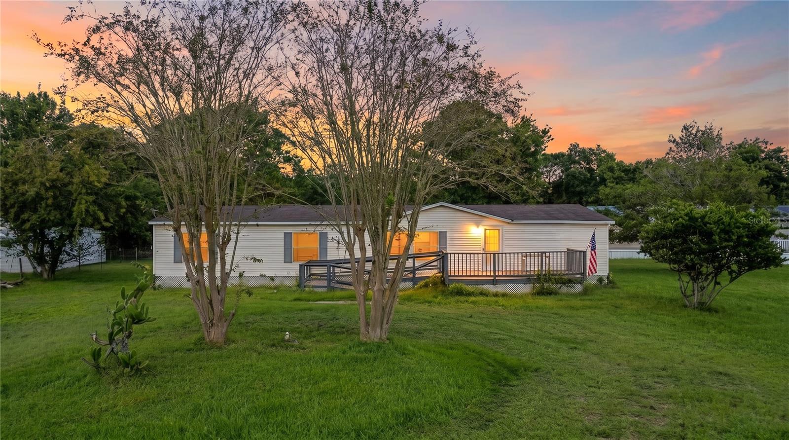 Welcome to 2016 Old Tyme Ave! Situated on 1.02 acres of cleared land, this spacious 4-bedroom, 2-bathroom double-wide manufactured home offers the perfect combination of space, comfort, and convenience. Step inside to find a bright and inviting interior featuring luxury vinyl plank flooring throughout, fresh interior paint, updated bathrooms, and an abundance of natural light. The spacious layout offers plenty of room for everyday living, while the large front deck provides the perfect spot to relax, entertain, or enjoy the peaceful surroundings. Major updates include a newer HVAC system and water heater, both replaced within the last year, offering added peace of mind. With over an acre of cleared land, there's plenty of room for outdoor activities, gardening, or simply enjoying the extra space and privacy. Conveniently located just off State Road 16 and only 15 minutes from historic Downtown St. Augustine, this property offers the opportunity to enjoy a more relaxed setting while remaining close to shopping, dining, and everything St. Augustine has to offer. Don't miss your opportunity to make this property your own!All information pertaining to the property is deemed reliable, but not guaranteed. Information to be verified by the Buyer. Be advised that cameras may exist recording audio and video inside/outside the property, such as ring doorbells. Photos are digitally enhanced and could be altered, please verify.