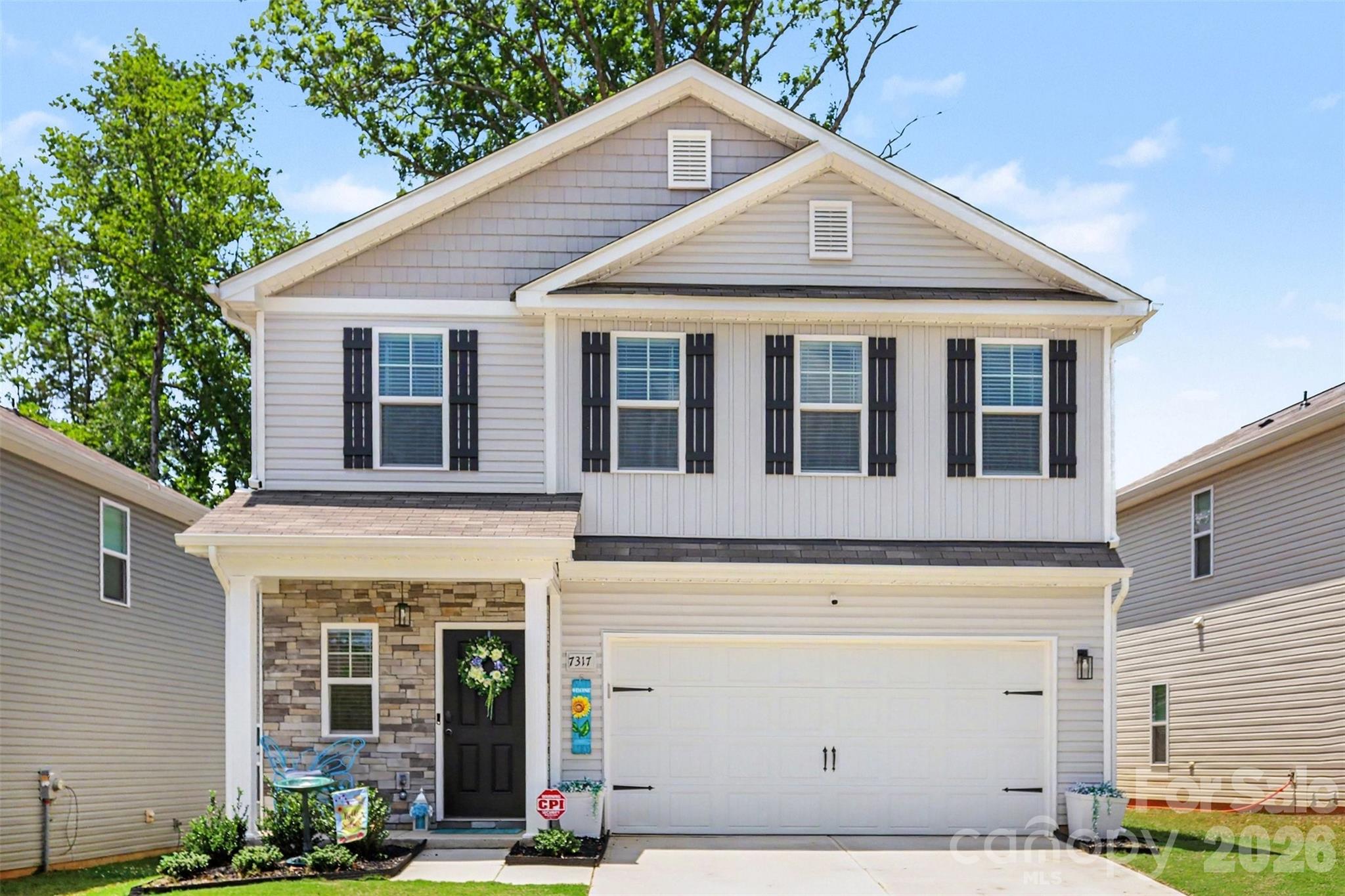 Welcome to this beautifully maintained residence in the sought-after Stoneygreen community, where modern design, premium upgrades, and everyday functionality come together seamlessly. This home shows like a model home and showcases high-end finishes throughout and an open-concept floor plan filled with abundant natural light, creating the perfect setting for both entertaining and comfortable daily living. The chef-inspired kitchen overlooks the spacious living and dining areas, anchored by a cozy fireplace and enhanced by built-in cabinetry that adds both style and functionality.Upstairs, the generously sized primary suite offers a peaceful retreat with a spa-inspired bath and walk-in closet, while the additional bedrooms provide flexibility for family, guests, or a home office. One of the secondary bedrooms has been thoughtfully transformed into an impressive custom walk-in closet, providing exceptional storage while offering the flexibility to be easily converted back into a fourth bedroom if desired. A convenient second-floor laundry room and ample storage throughout add to the home's functional appeal.  Step outside to enjoy the fully fenced backyard and patio, perfect for relaxing, entertaining, or letting pets play. The home is equipped with app-controlled exterior holiday lighting, allowing you to celebrate every season with customizable colors at the touch of a button. An alarm system also conveys with the home, providing added peace of mind.Residents of Stoneygreen enjoy neighborhood sidewalks, green spaces, and a welcoming community atmosphere, all while being conveniently located near I-485, Reedy Creek Nature Preserve, UNC Charlotte, and an abundance of shopping, dining, and entertainment. Combining designer finishes, thoughtful upgrades, and an unbeatable location, this move-in-ready home truly shows like a model and is one you won't want to miss.
