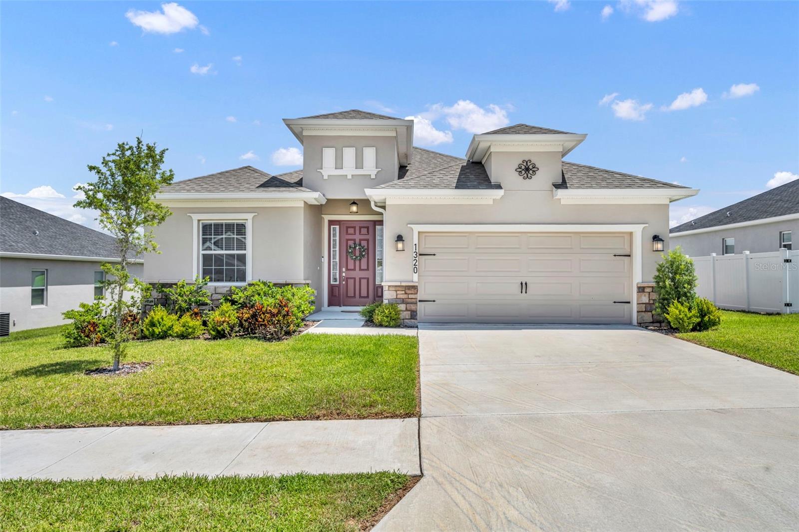 THIS HOME CAN BE PURCHASED WITH NO MONEY DOWN OR NO INCOME VERIFICATION! Welcome home to this beautiful nearly new retreat located just steps away from the peaceful shores of Lake Haines. Built less than three years ago, this home offers the perfect balance of modern style and that relaxed Lake Alfred charm you have been searching for. As you step inside you will immediately appreciate the bright open concept layout and the upgraded tile flooring that runs throughout all the common areas, the kitchen, and the bathrooms. This is a major plus for easy maintenance and keeping the home cool during the Florida summers.The heart of the home is the spacious kitchen featuring an oversized island and a massive walk in pantry that provides all the storage you could ever need. Just off the kitchen, the spacious laundry room includes a great drop zone to keep shoes and bags organized and out of sight as you come in from the garage. For added comfort and energy efficiency, every single room in the house is equipped with a ceiling fan to keep the air moving year round. The thoughtful split bedroom floor plan ensures everyone has their own space, featuring cozy plush carpet in all four bedrooms to keep the private areas feeling warm and inviting.One of the best parts of this home is the screened in back patio where you can enjoy the breeze and your morning coffee in total comfort. It overlooks a spacious backyard that is ready for pets and play. You get the quiet atmosphere of a small town community near public boat ramps and scenic walking trails while still staying just a short drive from I 4 and all the shopping and dining in Winter Haven. This home is a rare find that combines a prime location with move in ready upgrades. Come see why this neighborhood is the best kept secret in the area.
