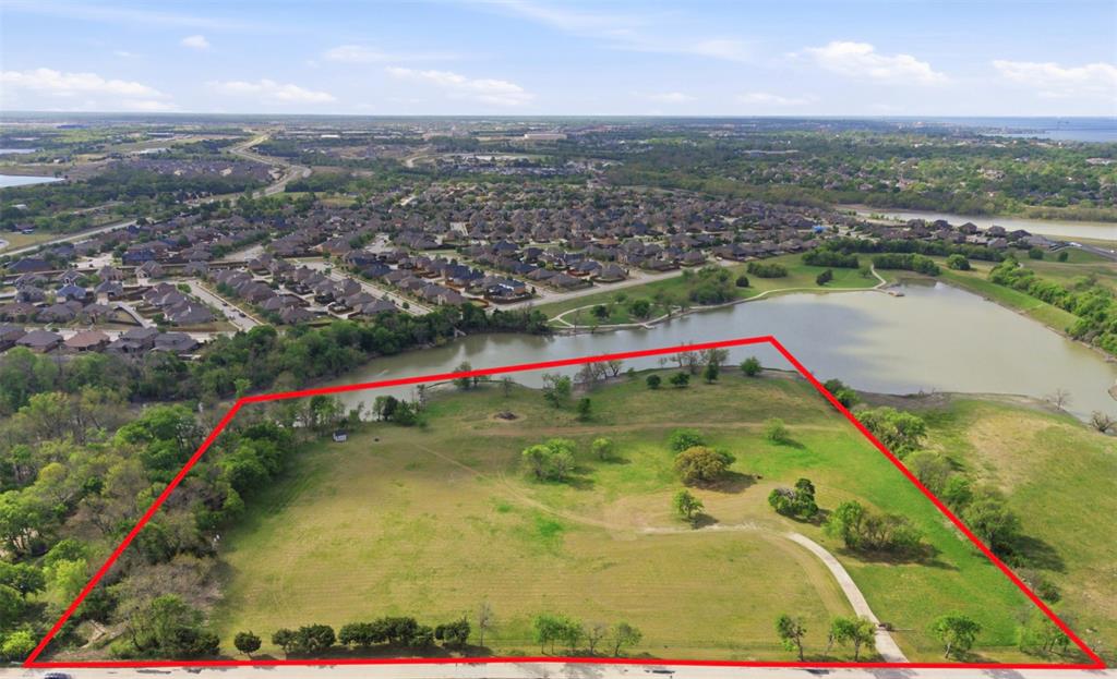 Lots of options....#1) PURCHASE ALL 12. ACRES & keep in AG Exemption as an investment or to build a single residence.  #2) Could be a DEVELOPMENT, (buyer would have to take it thru the City for approval), #3) Divide into TWO 6.3AC parcels that could remain in AG Exemption (except the part you take out to build a home on). #4) Current Owner is working with the city to PLAT into FOUR 3+AC homesites and once approved will offer these 3+AC homesite for $795K each. A buyer could contract a homesite fully contingent upon City Approval.  If current owner gets the 4 homesite Plat approved there would be deed restriciton in place that are still yet to be determined but more than likely min sq footage would be 3500SF to 4000SF min. Shops or Barns would be allowed (per city reqirements & code).  There is a rendering in photos that show what this could look like but is just an approx rendering, not exactly what would be approved. Contact agent for more detials.  Utilities Gas, Water, Elect appear to be nearby, buyer to verify.