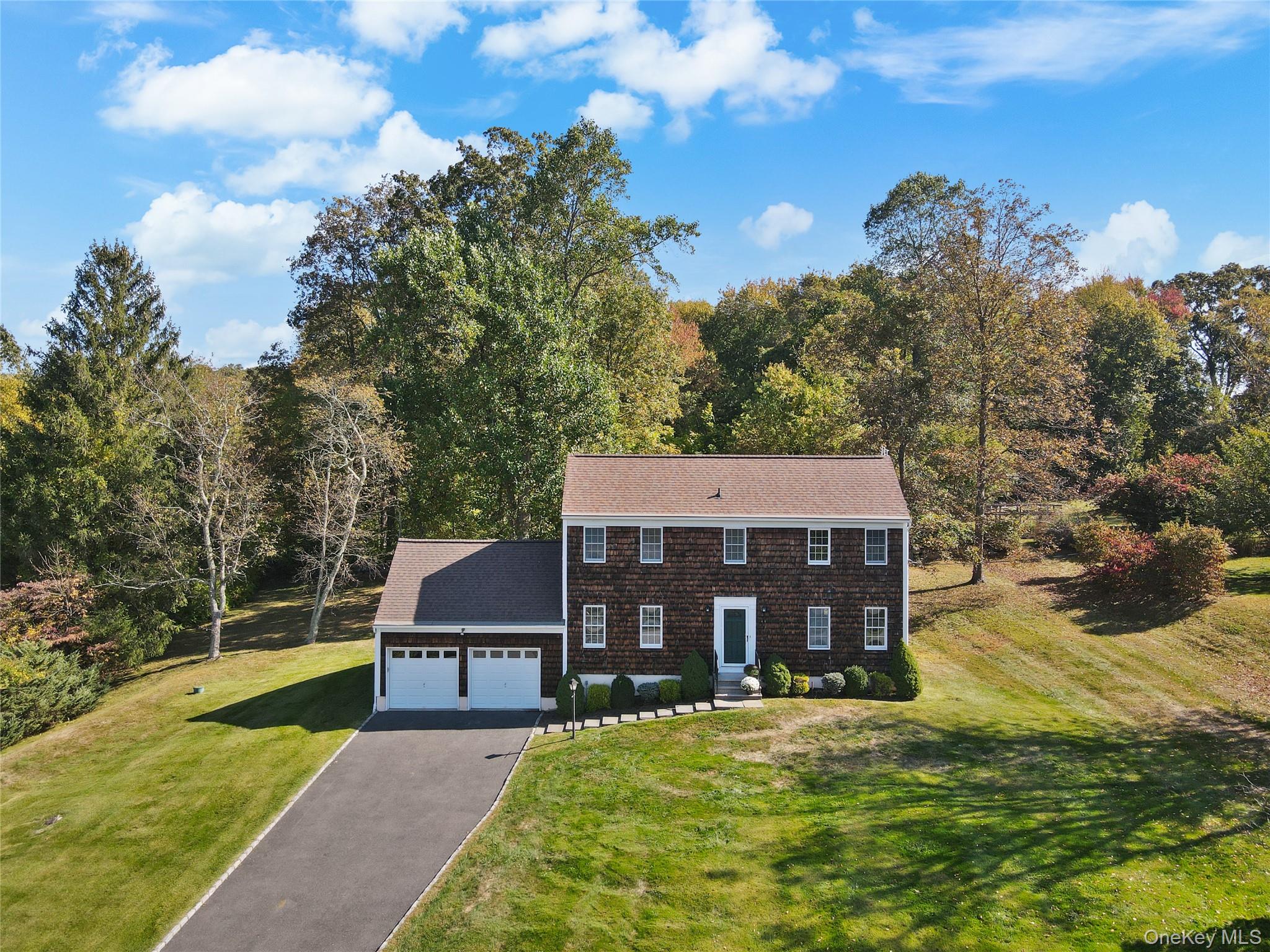 Set on a beautiful, gently rolling acre with distant views, this inviting three bedroom Colonial offers a perfect blend of comfort and convenience. Light-filled rooms, gleaming wood floors, and a freshly painted interior create a warm and welcoming atmosphere throughout. The home’s flexible layout provides extra space for guests, home office, or playroom, adapting easily to your needs. Enjoy the peaceful setting with a rambling lawn perfect for outdoor play and entertaining. Additional highlights include a whole-house generator, central ac, two car garage and a prime location close to park, restaurants and commuter routes.