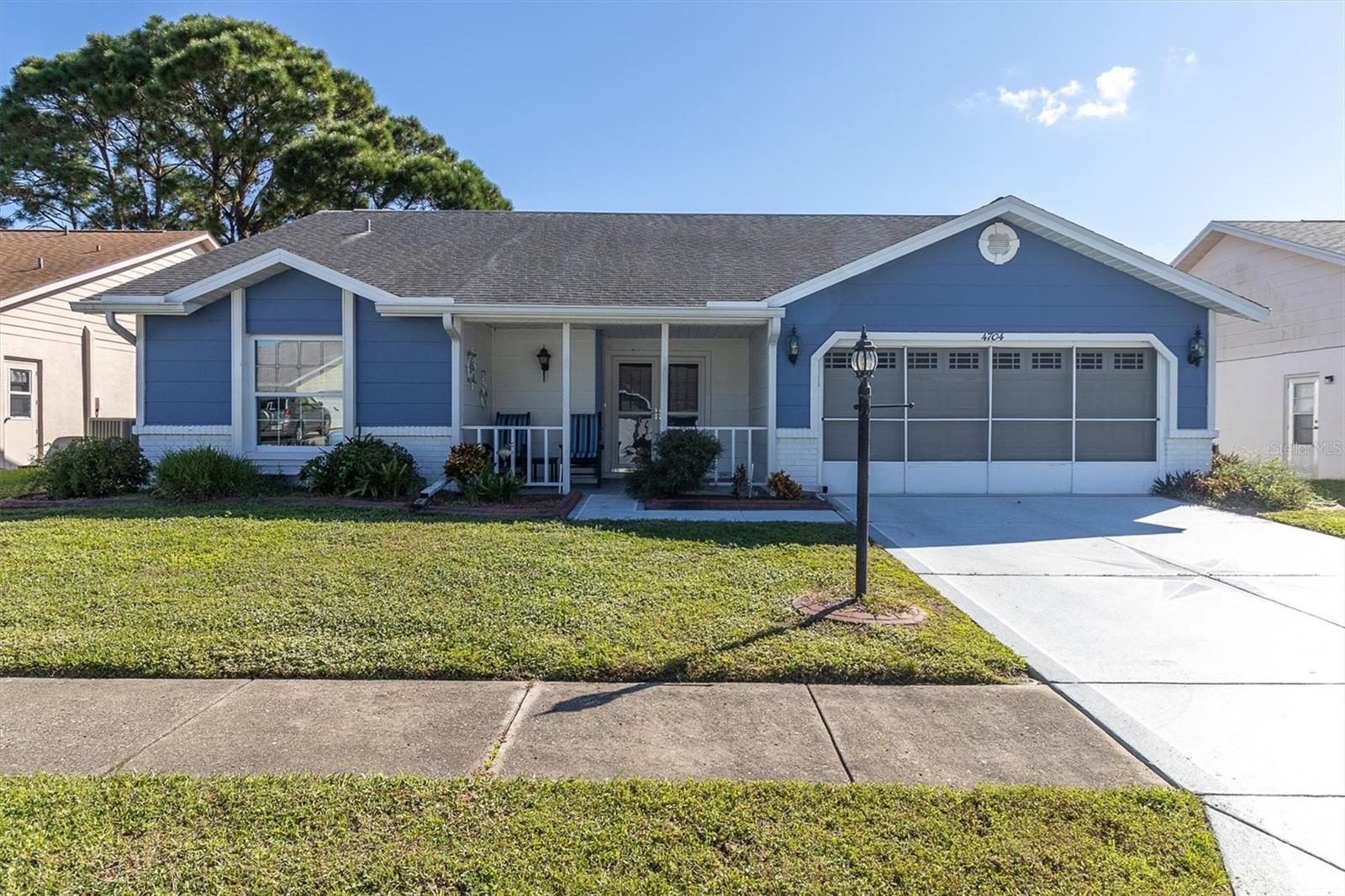 Welcome to Heritage Lake, one of New Port Richey's most popular 55+ communities, where affordable living and an active lifestyle come together! This single-family home offers a wonderful opportunity to enjoy the benefits of owning a detached residence with an incredibly low HOA fee of just $74 per month! Several important improvements have already been completed, including a NEW AIR CONDITIONER in 2024 and a NEW ROOF in 2018, providing peace of mind for years to come. One of the home's best features is the spacious 12x25 screened patio, added in 2019, featuring a concrete deck and insulated roof. This fantastic outdoor living space is perfect for enjoying your morning coffee, relaxing with a good book, or entertaining friends and family while enjoying Florida's beautiful weather.Heritage Lake is known for its welcoming atmosphere and outstanding amenities. Residents enjoy a beautiful clubhouse with a full calendar of social activities, a heated swimming pool and spa, tennis and pickleball courts, shuffleboard, bocce ball, billiards, card room, library, and a picturesque lakeside gazebo. Whether you prefer staying active or simply relaxing by the pool, there's something for everyone! Conveniently located near shopping, restaurants, medical facilities, golf courses, and everyday conveniences, with easy access to the Gulf Coast beaches and Tampa International Airport. Best of all, this is a true single-family home with a remarkably affordable monthly HOA fee, making it an excellent choice for those looking to enjoy the Florida retirement lifestyle without the high monthly expenses often associated with 55+ communities. Come see why so many residents love calling Heritage Lake home!