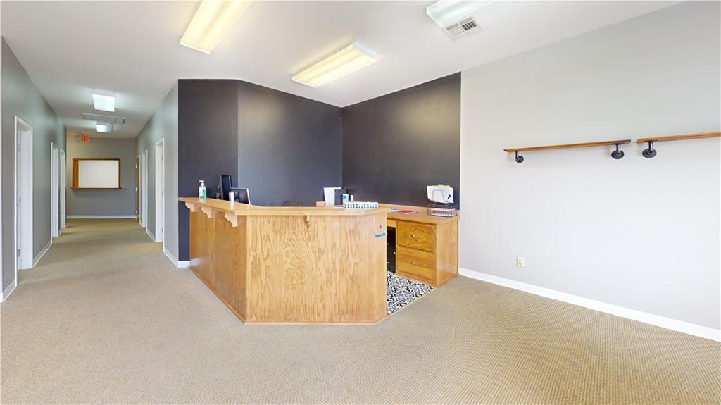 Highly functional and modern professional office suite available for  lease at an exceptional value of $900.00 per month. This updated space features clean finishes and a thoughtful layout, offering four private offices and a formal conference room perfectly suited for a growing business. Clients are welcomed into a large, bright waiting area with a dedicated front desk reception counter, while the back-of-house includes a functional copy room and ample storage closets for organizational efficiency. The suite is equipped with two restrooms: one ADA-accessible half-bath for guests and a private, employee-only bathroom conveniently situated within the copy room area. This turnkey professional environment is offered on a straightforward 12-month lease, providing a polished and move-in-ready solution for legal, medical, or administrative professionals. Tenant will receive one free advertising slide on the building’s electronic billboard included with the lease.