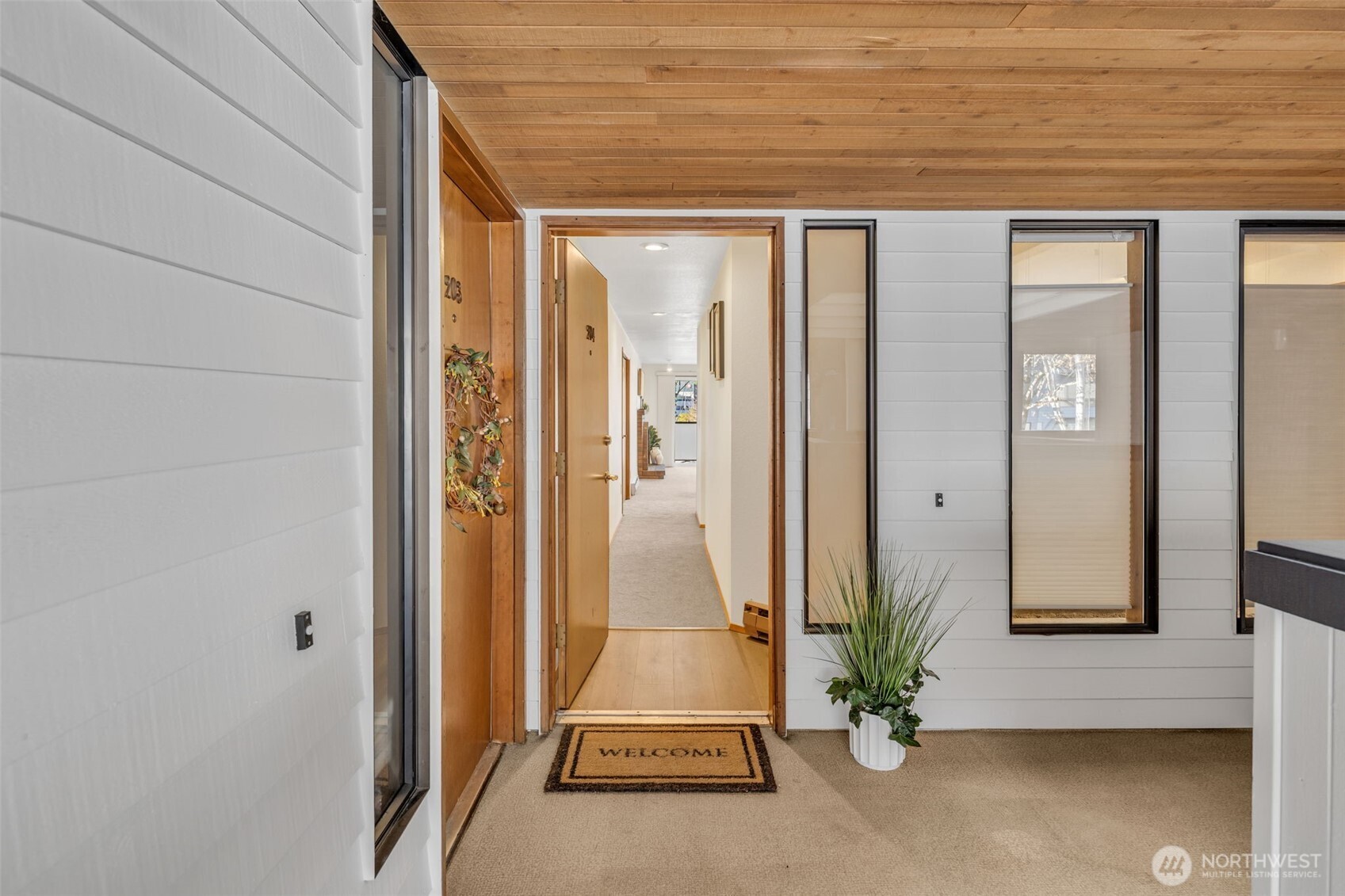 Stylish and move-in ready, this bright 1-bedroom, 1-bath condo features an open-concept layout with Fresh interior paint and New flooring throughout. A midcentury vibe shines with a built-in wet bar, in-unit laundry, dedicated storage, and one designated parking space. Enjoy indoor-outdoor living on your brand-new private covered balcony with additional storage. The well-maintained condo building has seen numerous HOA updates, including recent building exterior recladding and new windows, reflecting strong stewardship and pride of ownership. Experience downtown Mercer Island living at its best—stroll to the Farmer’s Market, browse Island Books, grab pastries at Macrina Bakery, or relax at Mercerdale Park. Pet-friendly building with no rental cap, making this an excellent opportunity for downsizers or investors seeking low-maintenance living.  Ideally located in the edge of downtown Mercer Island, just minutes to I-90, Seattle, Bellevue, parks, and the upcoming light rail station.