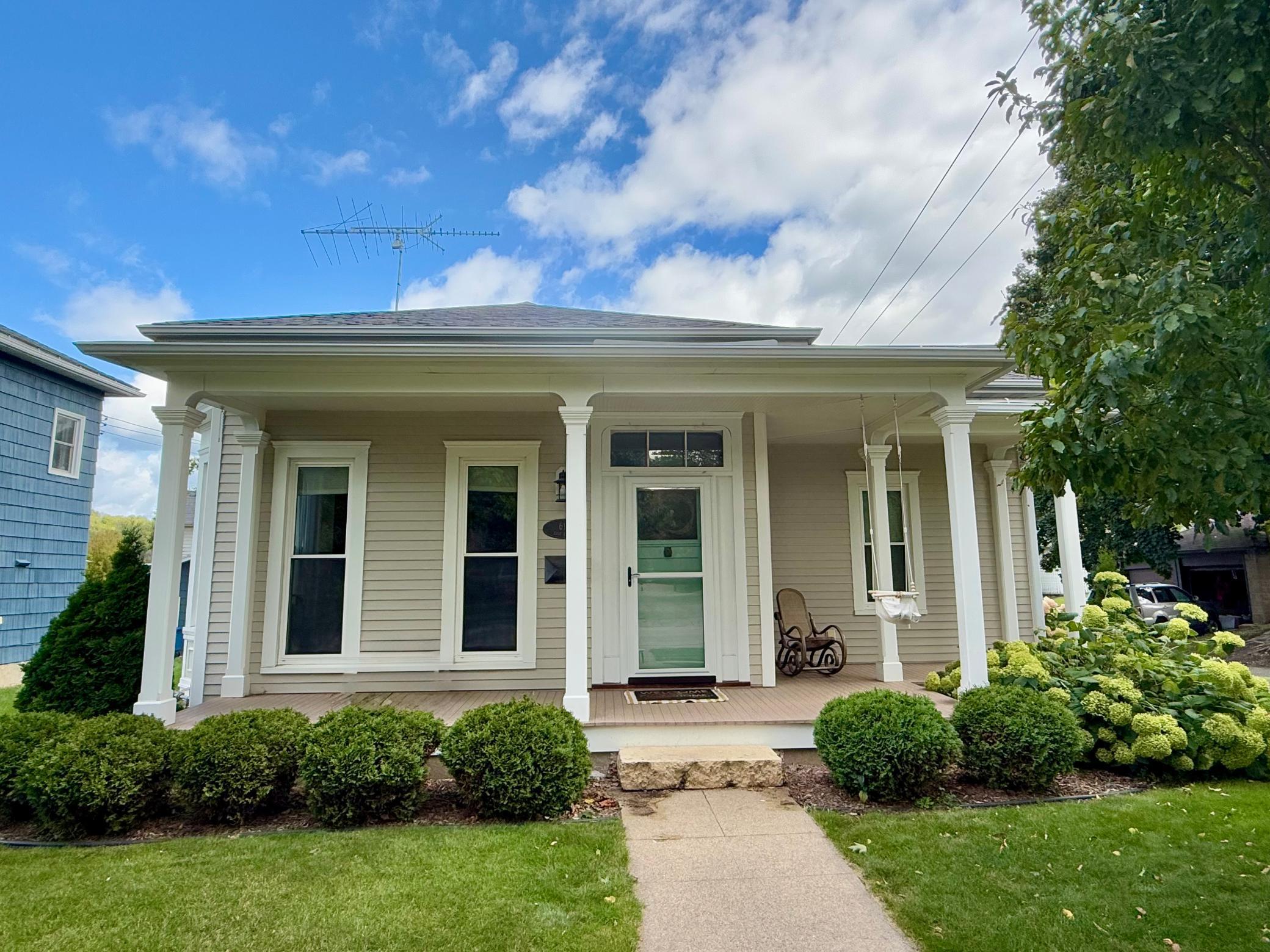 This charming historic home near downtown Red Wing blends timeless character with modern updates. Featuring two bedrooms and one bathroom, it offers cozy yet functional living with beautiful hardwood floors, stainless steel appliances, and quartz countertops. The meticulously landscaped yard and inviting patio create a perfect outdoor retreat, while the fully insulated garage with 8 foot garage doors provides excellent storage and workspace. With its unique character, updated finishes, and prime location close to shops and dining, this home is a true gem!