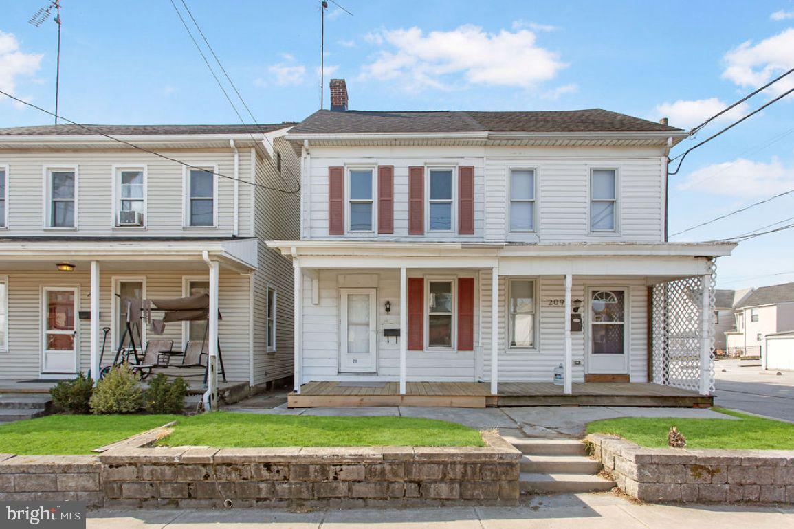 Beautifully remodeled duplex with cute front yard and porch.  Step inside to the living room and take note that the brand new LTV flooring carries throughout the first level.  The separate dining room is next and leads you to the brand new kitchen with white cabinets and all of the stainless steel appliances conveying for the lucky buyer.  There is even a half bath and the laundry on the main level for convenience.  Upstairs there are 3 bedrooms and another full bath.  Out back there is big fenced in back yard and a detached garage.  This cutie won't last long!