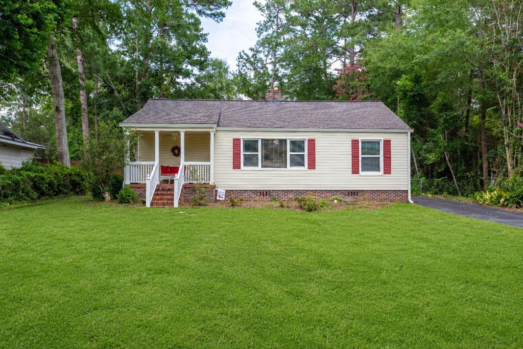 Cottage Charm within walking distance to Downtown Thomasville! This mid-century cottage with modernized practicality is irresistible!  Walkable to Downtown Thomasville and two blocks from McIntyre Park, the Center for the Arts and most city schools.  This updated 3/1 includes recent changes, such as a total kitchen renovation, complete with porcelain tile, stainless steel appliances, a coffee bar, and a pantry with custom pull-out drawers. Adjoining  a fully re-imagined laundry and mudroom with solid-surface countertops, a utility sink, large wall closets, and pet-friendly features, including a doggie door, and even an under-cabinet space for your fur baby's kennel!  This 1,189 approx. sq. ft. unit features a recently remodeled bathroom with custom tile work, luxury shower/tub combo, and everything you need at your fingertips! Three nice sized bedrooms, one of which is being used as an office is perfect for an office, home gym, nursery or entertainment room. Formal living room and dining room as well as bedrooms all feature magnificent professionally restored original hard wood flooring, recent lighting  windows and blinds. Outside is a .04 acre yard that is overlooked by a beautiful front porch. Efficient and easy to maintain vinyl siding, with gutters, not to mention recent privacy fence perfect for pets and privacy. Just drive into the attached garage, and exit into the secure, fenced backyard and into the house. Pets love the doggie door for their own independence! Garage has ample space and incudes a separate storage area for all of your decorations and hobbies. Attached shed area is perfect for riding lawnmower, golf cart and other necessary items that need their own space. But wait, there is more... additional yard space in back is perfect for pool, garden, or additional parking for trailer or boats. This home is a dream to maintain and features recent updates like total HVAC system and to many others to list here. Seller has a meticulous file of all improvements done to the home during current ownership and is available for review upon request.