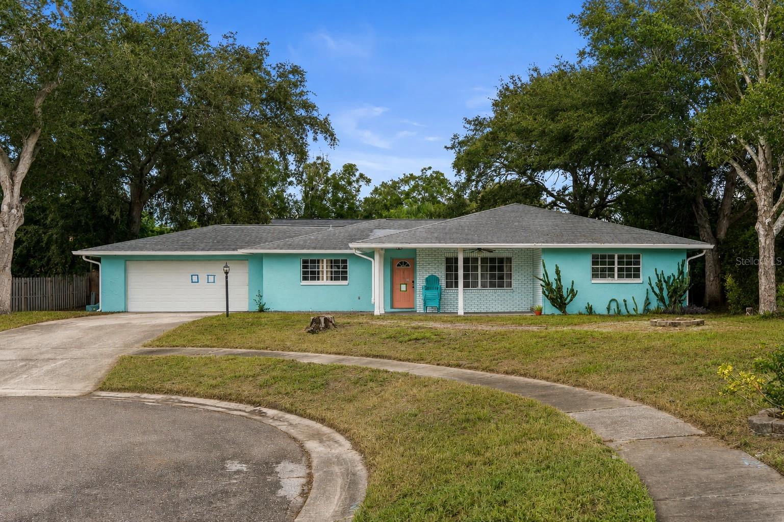 Welcome to this four-bedroom, two-bathroom home in Tarpon Springs, offering 1,608 square feet of living space and a desirable location at the end of a quiet cul-de-sac with no rear neighbors. The split-bedroom floor plan offers a functional layout, with a spacious primary suite featuring a private bathroom and walk-in closet, while the three additional bedrooms share a full bathroom. The dining area and kitchen combination provides a comfortable gathering space, with stainless steel appliances and wood-look vinyl flooring throughout. The spacious living room offers plenty of room to relax, while ceiling fans throughout the home add comfort and a dedicated laundry room provides added convenience. Outside, enjoy a front porch and fenced-in backyard with the privacy of no rear neighbors. Conveniently located near a variety of dining options, shopping, nature parks, and golfing at Innisbrook, this home offers a great opportunity to enjoy all that Tarpon Springs has to offer.