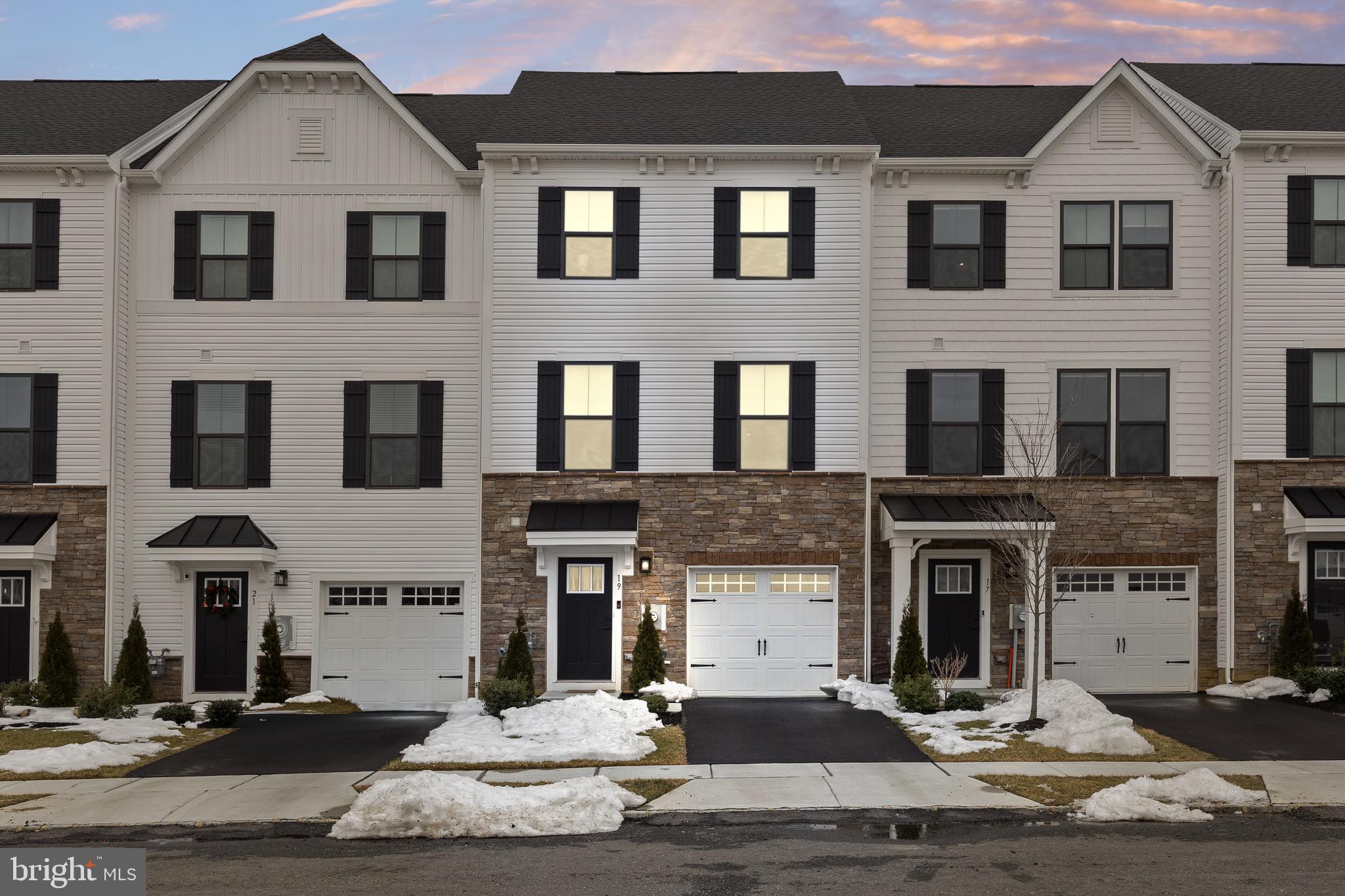 Absolutely stunning 3-story townhome in better than new condition. This is as close you can get to buying New Construction but better since it has been upgraded by the owner and barely lived in. This home offers 3 bedrooms, 2 full baths, and 1 partial bath with an open floor plan, everything looks brand new starting with the luxury vinyl flooring that you find in the foyer and throughout the main floor. The first floor offers a large family or great room with a custom accent wall, a sliding glass door to the backyard, a storage/utility closet, a foyer with a nicely appointed partial bath and the door to the garage. The home has 9 foot ceilings throughout, a neutral decor, recessed lighting throughout the home, the owner upgraded all the door hardware to matte black, there is attic space for storage, the home is centrally located with all major roadways just minutes away, and there is approval for a shopping center in walking distance. The main or second floor offers a spacious and open design with a large living room that is open to the dining room with a sliding glass door to the back deck and a gorgeous kitchen with white cabinets and matte black hardware, stainless steel appliances, granite countertops, a tile backsplash, and a large island with seating. The third level offers 3 large bedrooms including the primary bedroom, a beautiful full hall bath, 2 large bedrooms, and a huge primary suite that boasts a tray ceiling, a large walk-in closet, and primary bath that offers a double sink vanity, ceramic tile flooring, and a glass walk-in shower. The exterior of the home starts with a stone front facade, a covered front porch, a paved driveway that leads to a 1-car garage, maintenance free vinyl siding, a backyard that can be fenced-in and a large deck off the back with vinyl railings and trex decking. Don't miss your opportunity to see this wonderful home!