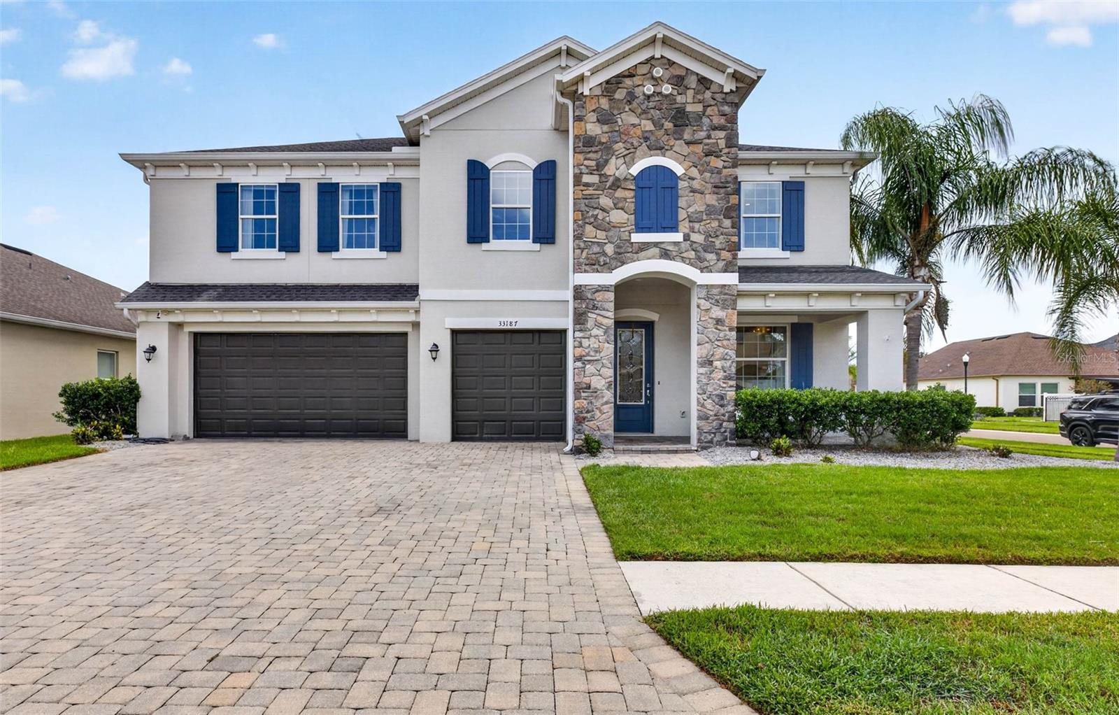 Exceptionally elegant & sophiticated former model home in Cypress Bend at Watergrass!  The most beautiful attention to detail throughout this home is waiting for you to see!  CalAtlantic's former model tucked away in the gated village of Cypress Bend is a corner lot with 5 bedrooms, 3.5 baths, pool home with so much attention to detail.  From the wood work throughout to the upgraded lighting fixtures, appliances, quartz countertops, and more. First floor entryway highlighted with natural light through the glass insert and large windows warms up and welcomes you home.  The office sits immediately to the right with built ins floor to ceiling.  First floor has a grand living space with upgraded kitchen area, dinette, and great room.  Your primary suite sits on the first floor with backyard pool views.  No details have been spared in the primary with ensuite bath and customized walk in closet.  Your outdoor living area has a full grill/kitchen, dining space, and saltwater heated pool.  Venture upstairs to the split bedroom floor plan featuring a central loft as a secondary living or entertaining space.  Each bedroom on the second floor has custom built in closets, lighting fixtures, window treatments, with two additional full bathrooms for convenience.  Cypress Bend has a park area steps away from this property or venture over to the Watergrass Club for year round events, resort pool (heated!), lap pool, fitness center, tennis courts, and meeting space. Promenade Park has a 3rd pool, dog park, splash pad, playground, and more- pickleball coming soon!  Watergrass is conveniently located near Publix, Florida Medical Clinic, Starbucks, ChickFilA, GoodVets, Nail salon, WG Dentistry, and so much more to come. The convenience of lifestyle is abundant outside the gates. On site is Watergrass Elementary or choose from Kirkland Ranch, Pinecrest Academy, or InPrep. Be sure to stay a while and experience the full FL lifestyle in this resort community!