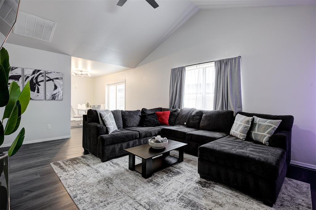 This beautiful, updated home offers a rare setting backing directly up to the water, providing peaceful views and a private gate with access to the pond. Featuring 3 bedrooms, 2 bathrooms, and a two-car garage, the home is light and bright throughout with vaulted ceilings in both the living room and primary bedroom that enhance the open, airy feel. The spacious kitchen is ideal for entertaining and includes stainless steel appliances, while the cozy fireplace anchors the living area. The primary suite boasts a walk-in closet, and the home sits on a large lot with stunning landscaping, ample parking out front, and plenty of space to enjoy both indoors and out.