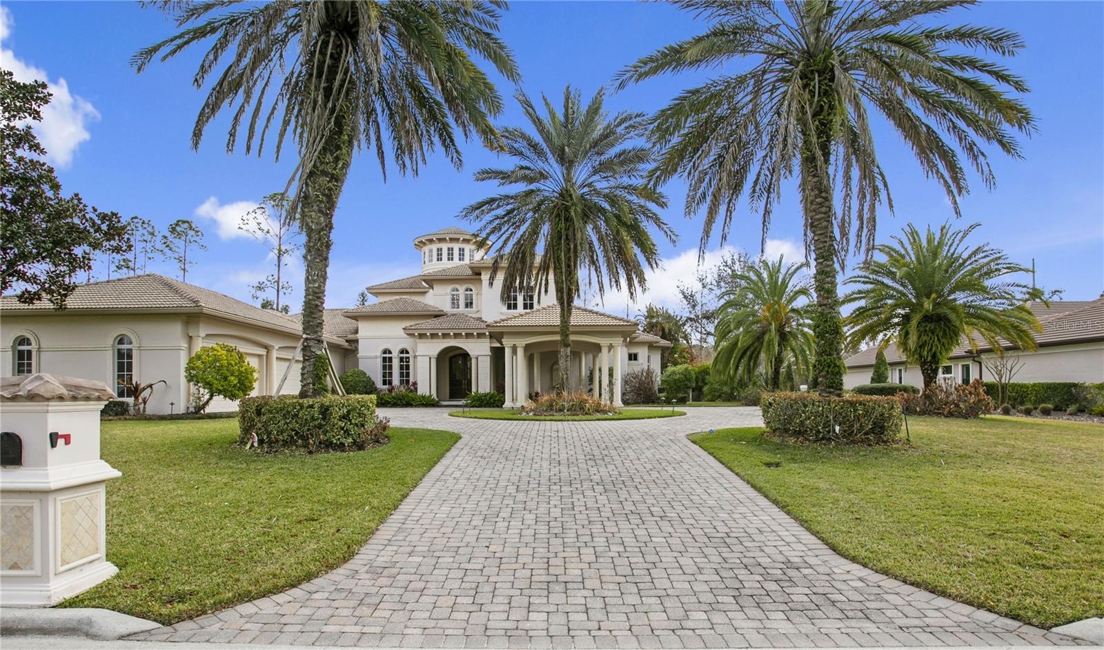 Under contract-accepting backup offers. Welcome to your dream home in Avila, Tampa Bay’s premier guard gated golf and country club community! Experience superb architectural integrity and meticulous attention to detail throughout this custom-built executive residence. Built by Alvarez Homes in 2009, this stunning two-story Mediterranean masterpiece is perfectly situated on a private cul-de-sac lot in the tranquil area of Comunidad de Avila. From the moment you arrive, the elegant porte-cochère sets an impressive tone, leading you into a breathtaking 35-foot grand foyer graced by a sweeping mahogany wood, marble, and iron staircase.The open floor plan is designed for the Florida lifestyle, with most rooms boasting views of the tropical infinity-edge heated pool and spa, an outdoor fireplace, a summer kitchen, and a lush, private backdrop—perfect for entertaining or relaxing in your own oasis. With over 5,790 square feet of luxurious living space, this five-bedroom, five full, and two half-bath home offers everything you desire.On the main level, enjoy a formal living room, an elegant dining room, a gourmet kitchen that opens to the spacious family room, and an opulent office with custom mahogany built-ins, rich wood flooring, and a cozy fireplace. The gorgeous master retreat features dual expansive walk-in closets, a spa-like bath with private water closets, a soaking tub, a steam shower, and top-tier fixtures for the ultimate relaxation.The gourmet kitchen is a chef's delight, equipped with two Sub-Zero refrigerators, double ovens, dual sinks in the island, a professional-grade gas cooktop, built-in microwave, Miele coffee center, ice-maker, and an oversized island that’s ideal for entertaining and buffets. Upstairs, three generous en-suite bedrooms, two with balconies, showcase walk-in closets, beautiful mahogany flooring, and an additional laundry room, offering comfort and privacy for family and guests alike.This exceptional home comes loaded with amenities including, hidden safe room, elaborate crown moldings and trim, a massive four-car garage, an Generac generator, surround sound throughout, security system, a fenced backyard, a paver driveway, and the elegant porte-cochère. Every detail has been thoughtfully designed to provide a refined yet comfortable living experience—don’t miss your opportunity to own this remarkable Avila estate