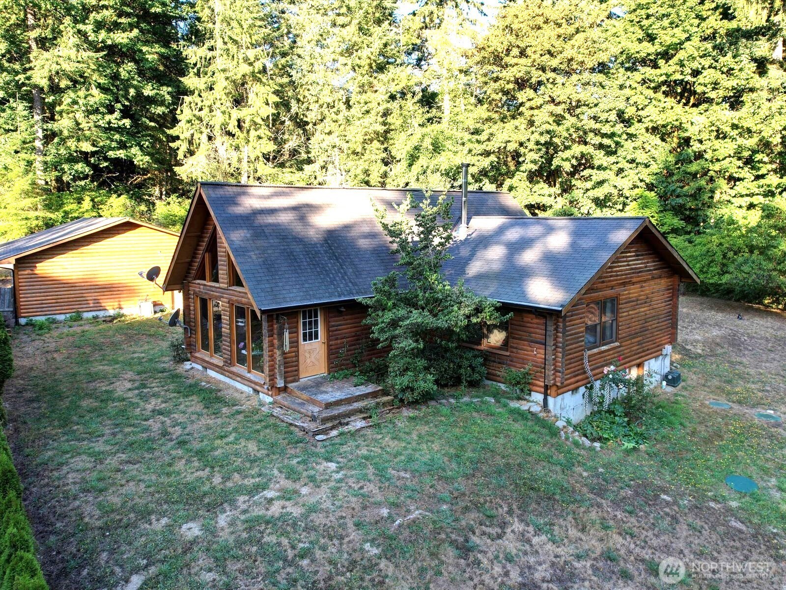 Olalla Bay Waterfront Log Home on 2.5 acres. First Time on Market for this Private Home with 2 Ensuites, Loft Area and Detached 1740 SF 4-Car Garage. A Unique Property w/ Partial Views of Olalla Bay Market & Bay. Estate Sale & being Sold AS IS. Galley Kitchen & Great Room w/ Vaulted Ceiling & Circular Staircase to a Loft Area, Perfect for a Home Office.Wood-Clad Windows, Bamboo Floors, Newer HVAC & Water Tank. 2 Bedrooms with baths plus 1/2 bath. Home needs TLC & repairs on Decks & Updating. Home on Shared Well & Private Septic. Trail to Approx 297 feet of Bay Front is rough, Bring boots. This property will need some work, but has components for a wonderful home & a great investment. Well Inspection and Septic Inspect complete, Health Letter shortly.