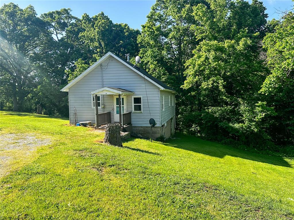 Cozy and Full of Potential!  This sweet 2 bedroom, 1 bathroom home is move-in ready with updates where it counts: newer furnace & water heater, newer windows on main level, updated electric & plumbing, and a touch of fresh paint.  The open layout feels spacious, welcoming, and the full unfinished basement is just waiting for your creative vision!