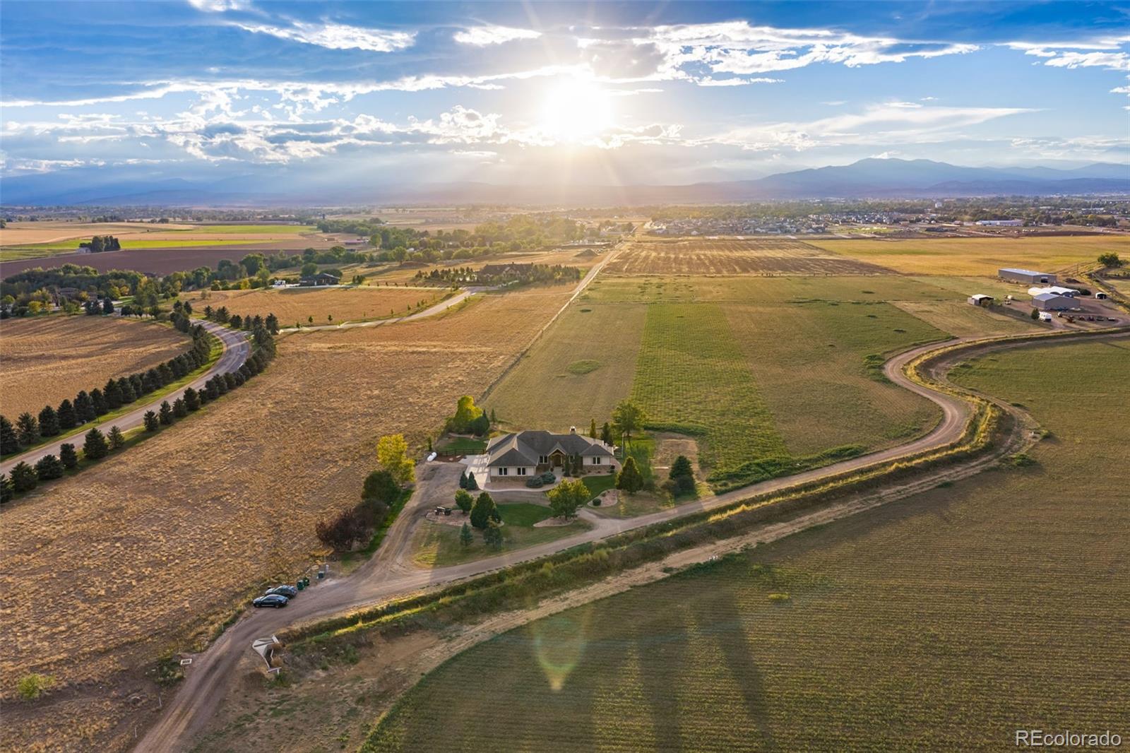 Location, Location, Location! 20509 County Road 3 offers a rare opportunity to own a 3.81-acre Berthoud estate w/ expansive, breathtaking Rocky Mountain views. Conveniently located near downtown Berthoud, Hays Market, TPC Colorado, restaurants, coffee shops & Berthoud Town Park, w/ easy access to Loveland, Longmont, Fort Collins & Boulder. NO HOA & NO Metro Tax. Zoned Agricultural. Enjoy privacy, views & outdoor living w/ a covered back patio, multiple shades, surround sound, built-in BBQ, fire pit, water feature & dog run. The beautifully appointed home features hand-scraped hardwood floors, upgraded carpet, 8' main-level doors, double-pane windows & alder trim. The open kitchen offers granite counters, center island w/ breakfast bar, walk-in pantry, new tile backsplash, crown-molded alder cabinetry, undermount lighting & stainless-steel appliances. The dining area captures incredible Rocky Mountain views, while the family room features a pellet stove, stone surround & built-in alder cabinetry. The luxurious primary suite includes a private retreat, patio access, walk-in closet & 5-piece bath w/ clawfoot tub, dual raised vanities & spacious shower w/ 2 heads & wand. Additional main-level bedroom w/ ensuite bath, executive office w/ mountain views, large laundry room & generous shake-off area. The finished basement features 9' ceilings, 2 bedrooms, 3/4 bath, spacious recreation/game room, wet-bar rough-in & abundant storage. Major systems include a Class 5 roof, fire suppression system, Navien tankless water heater, 2 high-efficiency furnaces, 2 A/C units & AprilAire humidifier. The oversized 1,105 SF 3-car attached garage is insulated, finished & includes 3 9' doors, EV connection, storage & separate basement access. E-mail brokers for a list of property features, floor plan or to schedule a private showing.