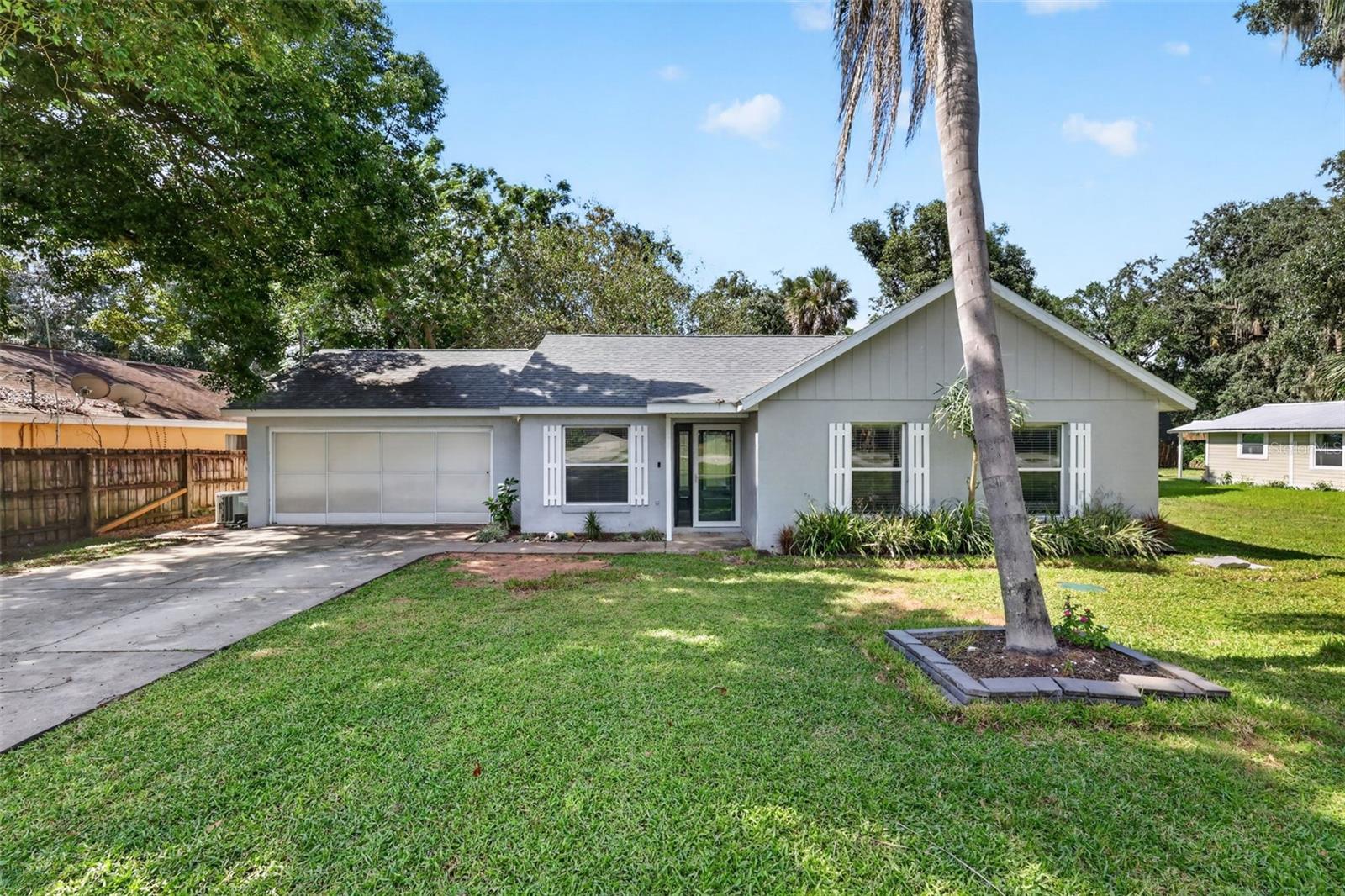 Welcome to Lakeview Heights in Eustis. This 3-bedroom, 2-bathroom home offers high ceilings, abundant natural light, and a functional open floor plan ideal for everyday living and entertaining. The kitchen features stainless steel appliances and overlooks the dining and living areas, creating a seamless flow throughout the main living space. Spacious guest bedrooms offer flexibility, while the primary suite features dual closets for added storage. Step outside to enjoy the large, fully fenced backyard, complete with a covered rear porch, storage shed, and a double gate wide enough to accommodate a boat, camper, or trailer. The two-car garage features finished floors, making it ideal for parking, a home gym, workshop, or additional storage. Enjoy the Florida lifestyle with a walking path at the end of the cul-de-sac leading to Lake Nettle, perfect for launching your kayak, canoe, or paddle-board. With no HOA, you’ll appreciate the added freedom and flexibility this property offers. Conveniently located near shopping, dining, parks, and downtown Eustis, this home combines comfortable living, outdoor enjoyment, and convenient lake access. Call today for your private showing!
